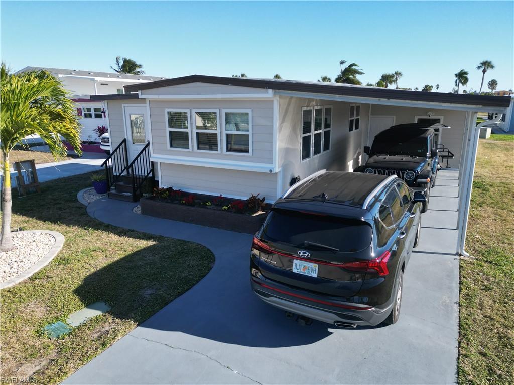 They say great things come in small packages.  This is just the case in this lovely Bayside Estates home.  Attractively priced at only $275,000 this home has been completely remodeled with new everything.  The wiring, plumbing, windows, drywall, insulation flooring, AC units, and even new state-of-the-art vinyl shiplap siding.  The siding is much much thicker than typical vinyl siding.  The siding is so thick it is rigid and can withstand anything mother nature throws at it.  It also provides a greater level of insulation.  The interior is nicely proportioned, and the layout is very functional.  For the single person or a couple, it has everything you would need and to make it yours, you won’t need to break the bank.  So make an appointment today to see this little gem.  
Bayside Estates is the best kept secret of Fort Myers Beach. This incredibly active and friendly 55+ community is the crown jewel on the gulf coast. Bayside estates is only 2.5 miles to the beach and is accessible by either car or boat--right from either your driveway or private boat dock. A very popular activity is riding your electric bicycles to the beach for the day and visit the world-famous Jimmy Buffett’s Margaritaville. Just don't step on a pop-top!!. Nearly all of the major retail vendors are within a very short driving distance for ultimate convenience. For those who don’t know a lot about Bayside Estates, it is a very fun place to call home---some would even say it’s a mature person’s playground. Whether you want to play pickleball, tennis or bocce ball or hang out at the community pool, or simply cruise the hood in your golf cart, there is always something going on around here. People are friendly and you will be warmly welcomed.