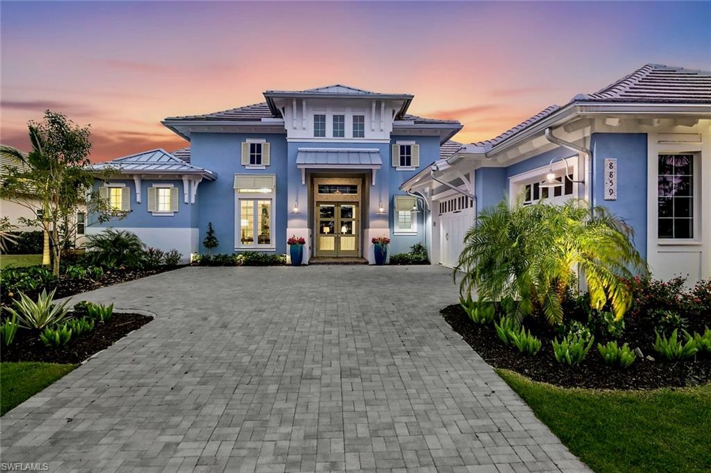 Exceptional coastal luxury awaits, in this 4 bedroom plus den, 4.5 bath estate home built by Stock Construction, featuring the highly sought-after Cocoplum model, perfectly positioned on one of the largest and most premium developer lots in the Isles of Collier Preserve. Welcome to 8859 Nevis Way, with panoramic, unobstructed sunset views over the lake and preserve, plus additional preserve views from the front, surrounding you with complete privacy and tranquility. Ideally located within the Isles in a private gated section of 61 homes, the Nevis Way location also provides convenient access to the Bayshore gate and Hamilton Harbor Yacht Club.

This home showcases refined craftsmanship throughout, with over $600,000 in additional high quality builder upgrades, including custom ceilings, moldings, trim, wood flooring, and built-in shelving. Additional enhancements include designer window treatments, draperies, and upgraded lighting. The gourmet kitchen is a standout, featuring an expansive island, ceiling-height cabinetry, quartz countertops, and premium appliances, including an induction cooktop, wall ovens, and wine refrigeration.
Seamless indoor-outdoor living awaits, with fully retractable sliders opening to a resort-worthy outdoor retreat. The outdoor space features Turkish natural stone pavers and a stunning 40-foot saltwater pool with spa, sun shelf, and water fountains. The impressive 62-foot covered lanai includes a spacious living area with gas fireplace, dining area, outdoor kitchen, and bar—all overlooking sparkling water and nature preserve views as far as the horizon. 
Inside, the thoughtfully designed split-bedroom plan offers ideal privacy for all. The spacious primary suite is a private sanctuary, complete with a spa-inspired bath featuring a walk-in rain shower, soaking tub, custom dressing table. The suite offers direct lanai access—perfect for morning coffee.
Some of the many additional highlights include a whole house water filtration system, specially insulated garage and integrated smart home technology with Sonos audio, security system, cameras, thermostats, TVs, and outdoor lighting. Enhanced lush landscaping completes the setting.
Residents of Isles of Collier Preserve enjoy a nature-inspired lifestyle, with over half of its 2,400 acres dedicated to lakes, preserves, and natural habitat. Amenities include miles of scenic walking and biking trails, waterways for kayaking and paddleboarding, resort-style pools, fitness center, dog park, tennis and pickleball courts, plus the waterfront Overlook Bar & Grill—all just minutes from downtown Naples.