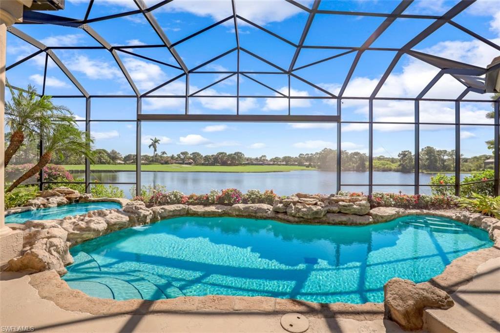 Entry to this home is through a private courtyard with water fountain feature. As you step into the foyer through the double door entry there is an amazing lake view that extends in the distance to the fairway and green of 10th hole of the Creekside course in Bonita Bay. This amazing view is part of the home - extending into the kitchen, morning & living rooms & main bedroom. This southerly facing lot arguably provides one of the best water & golf course wide water views in all of Bonita Bay. This well-maintained home is enhanced with rich interior architectural detailing & high-quality built-ins and cabinetry. The great room with 12’ ceiling opens to a recently re-screened picture window outdoor living area with free form pool & spa, and summer kitchen & gas grill. The open gourmet kitchen is fitted with quality cabinetry, Thermador wall oven, additional Kitchenaid stove/oven & refrigerator, 2 Maytag dishwashers, granite counter tops & large walk-in pantry. The feature dining
room has a wine room/wet bar with refrig & wine cooler. The owner’s bedroom suite has two built-in closets, wet bar & large separate sitting area overlooking the water view & spa/pool area. Reroofed 2015.