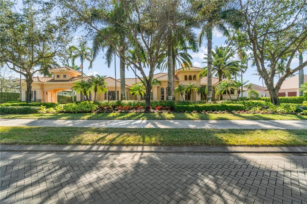 OPTIONAL TRANSFERRABLE GOLF MEMBERSHIP AVAILABLE FOR IMMEDIATE GOLF. Welcome to this stunning home located in the prestigious community of Quail West in Naples, Florida. Quail West is one of the premier golf course communities in Southwest Florida, with 2 golf courses, 8 tennis courts and 4 pickle ball courts, plus much more. As you step onto the property, you are greeted by lush landscaping that enhances the home’s curb appeal. This luxurious 4BR+Den home offers FANTASTIC REAR VIEWS OF THE GOLF COURSE AND LAKE and is the epitome easy living in Florida. Located on the 10th hole of the Lakes course, this southern exposure setting makes for breath taking sunset views over the 42' pool with spa. Upon entering the home through the 12' high wood doors you are greeted with an elegant and spacious interior, with high ceilings and large windows that flood the home with natural light, creating a bright and welcoming ambiance, not to mention the amazing views. Everything is top-of-the-line with custom cabinetry and finishings. The master suite is a true sanctuary with a morning coffee bar, luxurious en-suite bathroom with 2 separate commode areas, bidet, double shower, jetted tub and generous closet space. Additional en-suite bedrooms are spacious and thoughtfully designed, accommodating family and guests comfortably. The gourmet kitchen is a chef's dream, complete with modern appliances, 2 dishwashers, 2 sinks, warming draw, built-in miele coffee maker, ppt-filler, butlers pantry, ample counter space and a breakfast bar which is perfect for entertaining guests and culinary enthusiasts. The wine room is centrally located off the dining room, kitchen and living room with wet bar. Library is tastefully done with Brazilian cherry flooring, wood built-ins and custom ceiling.  The living area opens to an expansive patio that is ideal for alfresco dining, lounging, or simply soaking in the beautiful Florida sunsets.  Outdoor kitchen/lanai has built-in gas grill, bar refrigerator and sink with screened in area. 3-car attached over-sized garage plus a detached golf cart garage connected by a porte-cochere in the court yard. 500 gallon Underground propane tank for cooking and heating the pool/spa. 5900 Burnham Rd is a rare find that promises to elevate your living experience on one of the most desirable streets within Quail West with both golf and water views and located in Collier county.  Close to the club house, golf and all the amenities that Quail West has to offer.  This home offers easy access to Naples' renowned beaches, shopping, dining, and cultural attractions. Whether you’re seeking an active lifestyle or a peaceful retreat, Quail West has it all.  This is a home is being sold furnished with designer furniture, so don’t miss this opportunity to own a slice of paradise in Naples! Discover the endless possibilities that await you at this remarkable property.