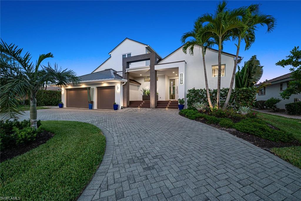Stunning custom waterfront residence in sought-after Royal Harbor. This one-of-a-kind property has an open, split-bedroom floor plan with two master suites! The high ceilings and door frames made this the perfect home for the complete slab-up renovations in 2019 including, but not limited to all new plumbing, wiring, 16,000 lb boat lift, dock AND seawall. The endless upgrades and modern finishes throughout make this home feel like brand new construction! The outdoor covered living space is unlike anything in the neighborhood and built for entertaining. It has plenty of space for cooking on the built-in flat top EVO grill with full kitchen, large dining space and seating area to relax while watching tv over the stunning fireplace. The salt water dipping pool/spa is perfect for cooling off on a hot day or soothing aching muscles after an active day! The sun shelf allows you to relax on a lounge chair with the water beneath you. The residence is finished with a full house water system, whole house generator and impact doors/windows. Ideally located just minutes from 5th Ave. South's and 3rd St. South's fine dining, world-class shopping, entertainment and white sand beaches.