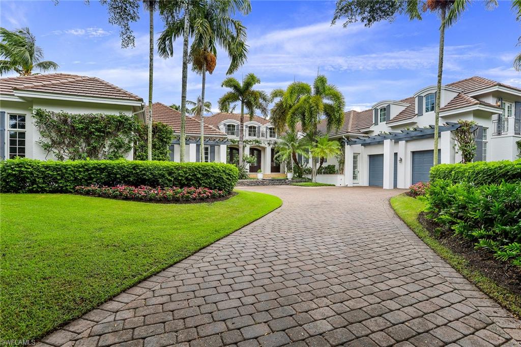 Beautiful and elegant home with lake views and Port Royal Associate membership eligibility. Located in the charming community of Little Harbour, this five-bedroom plus a den residence offers superior livability. An expansive great room greets you with volume ceilings customized with built-ins and a wall of French doors that offer views of the sunlit pool and tranquil lake scenery. The eat-in kitchen is highlighted with custom cabinetry, and stainless steel appliances, while the breakfast and family room offer additional gathering spaces. The home features three guest bedrooms with en-suite baths and a separate cabana with a morning kitchen. A main-level master suite features a luxurious master bath and a spacious dressing area. On the exterior, a covered lanai complete with a built-in grill and dining space overlooks the lake with water feature, completing this exceptional home. Little Harbour residents enjoy a premier location to the beach, gated security, and community boat docks.