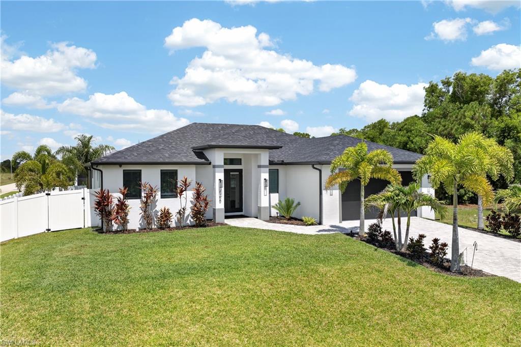 MODERN LUXURY, RESORT-STYLE OUTDOOR LIVING, AND EXCEPTIONAL CRAFTSMANSHIP—WELCOME TO YOUR DREAM HOME! Built in 2024 by the renowned TOTO CUSTOM HOMES, this stunning 3 BEDROOM, 2 BATHROOM, 2 CAR GARAGE POOL HOME perfectly blends sophisticated design, thoughtful functionality, and high-end finishes throughout. Situated on a FENCED CORNER LOT in one of Cape Coral's rapidly growing areas, this better-than-new residence offers everything you've been searching for—without the wait of new construction. From the moment you step inside, you'll appreciate the home's bright, open-concept design, abundant natural light, and impeccable attention to detail. Every inch of this home showcases modern elegance, with quality craftsmanship and finishes that create a warm yet luxurious atmosphere. At the heart of the home is a beautifully designed kitchen that is as functional as it is impressive. Featuring a LARGE CENTER ISLAND WITH CABINETRY ON BOTH SIDES, EXTRA-TALL UPPER CABINETS THAT EXTEND NEARLY TO THE CEILING, abundant storage, and a spacious layout, this kitchen is perfectly suited for everyday living and entertaining alike. Designed as a true owner's retreat, the expansive primary suite features a versatile ATTACHED BONUS SPACE ideal for a home office, nursery, fitness room, or private lounge. With DIRECT ACCESS TO THE POOL AREA, you'll enjoy the perfect blend of indoor comfort and outdoor living. The luxurious ensuite bathroom features DUAL VANITIES, generous space, and a thoughtfully designed layout that enhances everyday comfort. The WELL-SIZED GUEST BEDROOMS provide comfortable accommodations for family and visitors, each featuring LARGE CLOSETS that offer exceptional storage while maintaining spacious, inviting living areas. Step outside and experience your own private backyard oasis. The HEATED POOL provides year-round enjoyment, while the OUTDOOR KITCHEN creates the ultimate space for entertaining family and friends. Whether you're hosting weekend gatherings or simply relaxing poolside, this outdoor living area truly embraces the Southwest Florida lifestyle. Designed for both beauty and peace of mind, the home also features HURRICANE IMPACT WINDOWS AND DOORS along with a WHOLE-HOME WATER SOFTENER SYSTEM. With construction completed in 2024, everything throughout the home is virtually brand new, allowing you to enjoy modern efficiency and low-maintenance living for years to come. Conveniently located near shopping, dining, parks, golf courses, boating, and all that Cape Coral has to offer, this exceptional property combines luxury, functionality, and location into one incredible package. IF YOU'VE BEEN SEARCHING FOR A HOME THAT STANDS OUT FROM THE REST, THIS BEAUTIFULLY CRAFTED TOTO CUSTOM HOME IS A MUST-SEE. SCHEDULE YOUR PRIVATE SHOWING TODAY AND EXPERIENCE FLORIDA LIVING AT ITS FINEST!