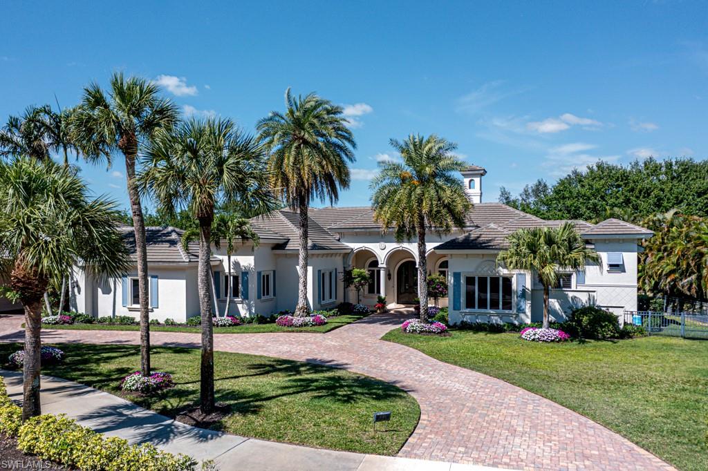 Stunning single story estate home caters to large families and entertaining.  Built in 2007 by Imperial Homes, it has been impeccably maintained and updated to make it comparable to newer homes.  (See special improvements and updates in attachments)  Westerly facing, you will enjoy incredible sunsets from your spacious and beautifully appointed lanai and pool area with outdoor kitchen, fireplace, infinity edge pool and spa, and double picture window screen to enhance the views.  The property is surrounded by fencing to keep pets safe. More than 7,900 SF of indoor and outdoor living space features 5 bedrooms plus den, 2 master bedroom suites, 4.5 baths, gourmet kitchen with Wolf and Sub-Zero appliances, and 4-car garage on oversized lot.  Rear of property overlooks the 10th hole of the Lakes Course.  Recently repainted exterior, new roof in 2019, 3 A/C systems all new within the last few years, whole house generator and the list goes on.  Quail West is a crown jewel community in Southwest Florida with 2 golf courses, beach club, a 70,000 SF state-of-the-art clubhouse with tennis, pickleball, fully-staffed fitness center, spa, hair salon, elegant dining and social opportunities throughout the year.  Minimum of house membership is required at every Quail West address. OPTIONAL TRANSFERRABLE FULL GOLF MEMBERSHIP AVAILABLE.