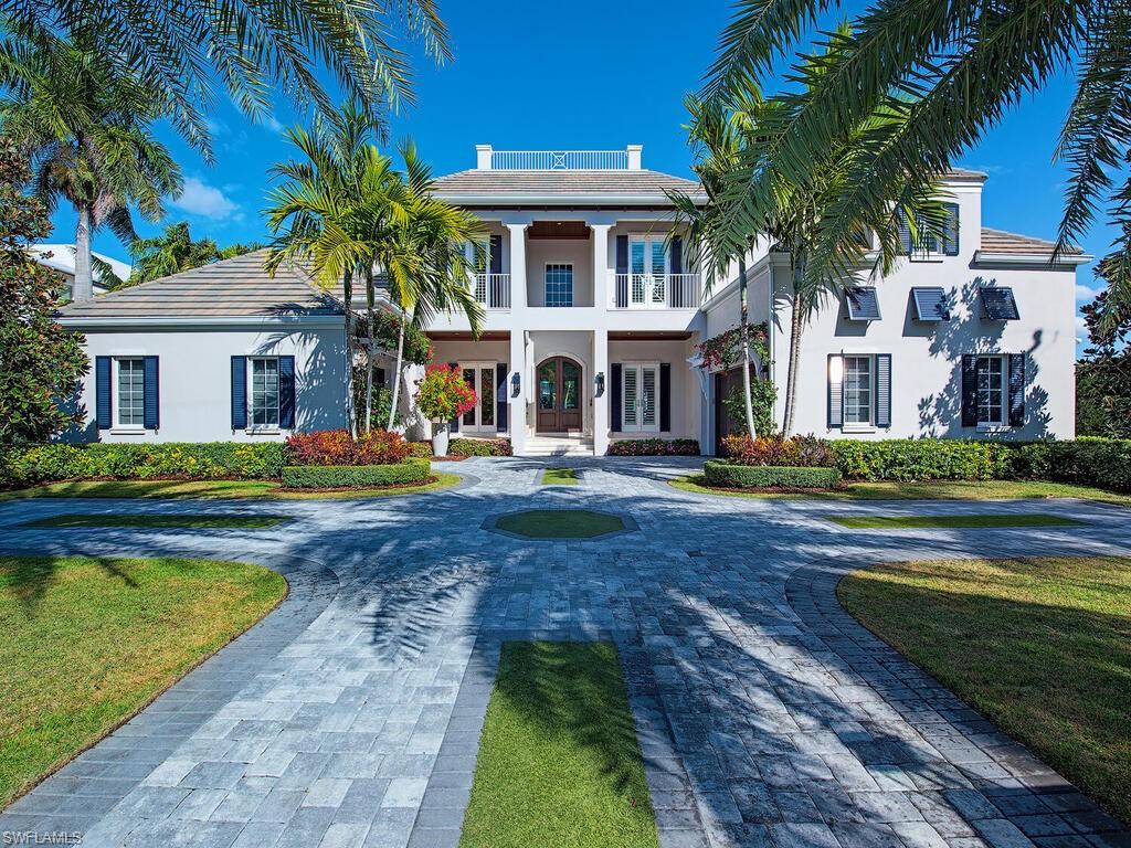 Exceptional Port Royal residence offering 6,436 square feet of refined coastal living, professionally redesigned by MHK and delivered fully furnished with custom interiors. Thoughtful architectural detailing and high-end finishes are showcased throughout, including Legno Bastone oak flooring, bespoke wood accents, and a striking wrap-around staircase anchoring the home’s interior.

The main living areas open seamlessly to the outdoors through retractable glass walls, revealing a resort-style saltwater pool and spa designed for both entertaining and private enjoyment. A temperature-controlled, 288-bottle walk-in wine room is positioned beneath the staircase, adding both function and visual impact.

This two-story home is equipped with elevator access and an extensive list of modern systems and conveniences, including high-impact windows and doors, electric hurricane shutters, whole-home lighting control, multiple HVAC systems with dehumidification, generator, propane tank, integrated security, and air-conditioned storage.

A rare opportunity to acquire a move-in-ready home in Port Royal without the timeline or expense of new construction. Port Royal Club eligibility.