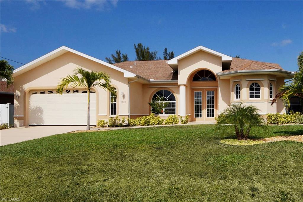 Gulf Access Pool Home in the highly desirable SW Cape Coral location. Remodeled and move-in-ready! Featuring 2,106 sq.ft. with 3 bedrooms & 2.5 baths.  Large kitchen has been redone with new stainless steel appliances and granite countertops open to the family and living room.  The master bedroom overlooks the pool and canal, and includes his & her walk in closets. The master bathroom includes dual vanity, jetted tub, and large walk-in shower. Two spare bedrooms with closets for plenty of space for family.  Sliders throughout the house overlooking the water, many of the sliders are pocketing to fully open the home up and enjoy the indoors and outdoors. Beautiful elevated pool deck overlooking the water, with decorative waterfall for ambiance and half pool bath. A new A/C August 2016, new wood-like flooring, new carpeting, fresh paint inside and outside, freshly painted garage floor, driveway, and pool deck, and updated landscaping! Desirable SW 33914 area code minutes away from Cape Harbour & Tarpon Point for waterfront dining and shopping. Grocery shopping, multiple restaurants, banking, and entertainment all close by and with easy commute to Ft. Myers and Beaches.