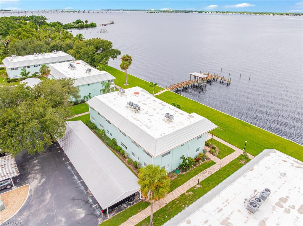 Beautifully remodeled, move-in ready waterfront condo featuring 2 spacious bedrooms and 2 bathrooms with stunning water views, custom closet cabinetry, and modern finishes throughout. Enjoy breathtaking sunsets and water access through the community dock. Conveniently located near downtown Fort Myers, shopping, dining, and major roadways.