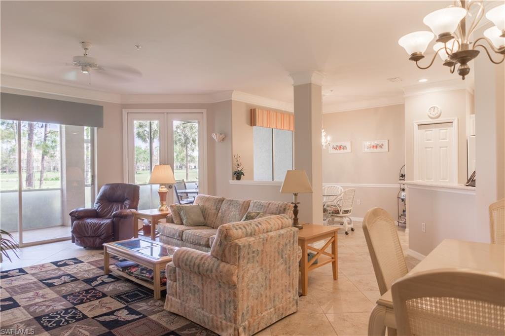 MOTIVATED SELLER !!  PRICE REDUCTION !!  CAPITAL ASSESSMENT IS PAID IN FULL !!  This first floor unit features  NEW A/C August 2016, screened entry way, upgraded kitchen counter tops and travertine tile with glass back splash, new dishwasher, crown molding and chair rail in living area.  New carpeting in guest bedroom, and large diagonal tile in living area, kitchen and lanai.  The lanai over looks the 16th fairway of the newly designed and renovated golf course.  Vanderbilt Country Club has a beautifully remodeled and expanded clubhouse, a new fully attended health and fitness center and the new Terrace Cafe for informal dining by the beautiful community pool and tennis courts.