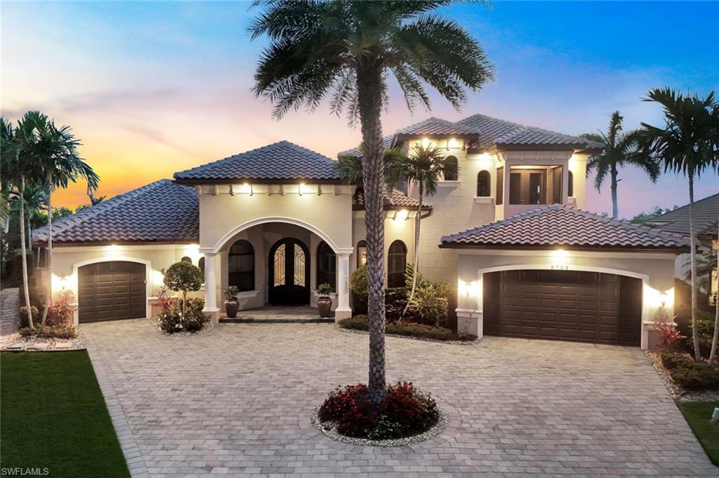 THIS IS THE ONE YOU’VE BEEN WAITING FOR! LOCATION, LOCATION, LOCATION! RARELY AVAILABLE OVERSIZED HOMESITE WITH SOUTHWESTERN REAR EXPOSURE, 180' OF DEEP DIRECT ACCESS WATER FRONTAGE, AND STUNNING WATER VIEWS OVERLOOKING THE SOUITH SPREADER WATERWAY AND PROTECTED NATURE PRESERVE! Located in “The Estates of Harbour Preserve”, Cape Harbour’s most EXCLUSIVE gated enclave, this STUNNING Aubuchon-built Home is sure to please the most discerning buyer. This custom home offers 4,189 sq ft of living space and is being offered FULLY FURNISHED AND BEAUTIFULLY DECORATED, making it truly move-in ready. The location allows residents to walk, bike, golf cart, or boat to Cape Harbour Marina’s restaurants, boutique shops, and live entertainment, creating the perfect blend of privacy and coastal lifestyle. The outdoor living space is exceptional and designed to take full advantage of the waterfront setting. A HEATED SALTWATER POOL and SPA with SUNSHELF anchors the lanai, while a dramatic custom water wall that converts from waterfall to fireplace creates a striking focal point. The two-story screened lanai with picture-window cage frames the wide water and preserve views while maintaining an open feel. An Outdoor Summer Kitchen with grill, bar seating and multiple gathering areas makes this space ideal for entertaining or simply relaxing while enjoying breathtaking sunsets. Boaters will love the Large Wrap-Around Dock w/ 13,500 lb. Boat Lift, a 5,000 Lb. Lift for Jetskis, 180 feet of Captains Walk that spans the entire length of the seawall, & Tiki Hut for sipping drinks by the water. All positioned for QUICK ACCESS to the GULF and MINUTES to OPEN WATER while still enjoying the privacy of the preserve backdrop. Inside, the home features soaring ceilings with Coffered and Tray details, a gas fireplace in the Great Room, and a Chef’s Kitchen with Custom Wood Cabinetry, large island with prep sink and seating, Gas Range, Wall Oven, Warming Drawer, Advantium Oven, & Walk-in Pantry. The Dining area overlooks the Pool, Lanai, and Waterfront, creating a beautiful setting for entertaining or enjoying a nice meal. The first-floor Primary Suite offers Lanai Access, Dual Vanities, Soaking Tub, Walk-through Shower, & 2 Walk-in Closets. The main level also includes a Guest Suite with ensuite bath, Den/Home Office, Captain’s Room Lounge with a Custom Bar, Pool Table, TV & Seating Area, and a Pool Bath. There is also a large laundry room & mud room. Upstairs there are TWO Additional Ensuite Bedrooms opening onto a Large Balcony, A Loft with Bunk Beds, 2nd Laundry room & a HOME GYM! Additional highlights include IMPACT RESISTANT WINDOWS & DOORS, Electric roll-down Storm Shutters on the lanai, buried 500-gallon Propane Tank serving the Gas Range, Fireplaces, Summer Kitchen, and Tankless Water Heater. NEW ROOF (2023), NEW POOL CAGE (2025), updated A/C, Whole-Home Water Filtration System, and Leak Detection System. Don’t let this one slip away! Secure your “Piece of Paradise” today!