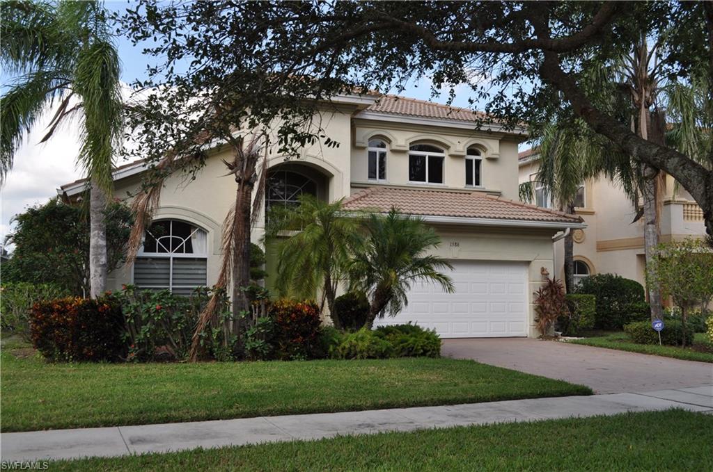 Beautiful professionally decorated former model home on long lake views with custom pool and screened lanai.    This house impeccably clean.    Gourmet kitchen with stainless steel appliances and custom back splash.    Tiled though out the living areas and bathrooms with custom inlays in contrasting colors.   Built-in entertainment center in family room, built in bar counter with custom mirrors in loft/game area complete with pool table.  This home is light, bright and airy.   Beautiful views from the master bedroom as well as covered lanai area.    Out your front door in a preserve view.   Custom window treatments though out the home including plantation shutters.    Valencia Country Club is built around a public golf course, there is no membership requirements.    Community Clubhouse with pool and fitness facilities.   Low HOA dues include gated guard entry, clubhouse, exterior pest, irrigation, lawn and landscape.