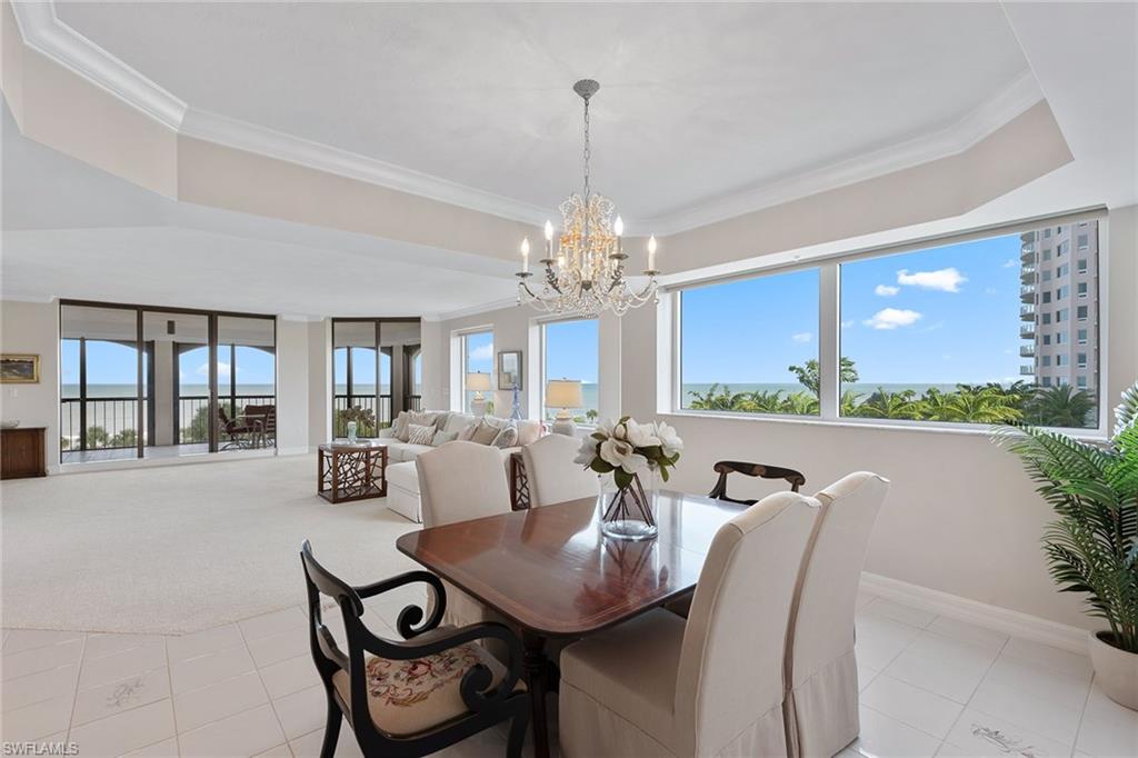 Gorgeous Gulf views! Above the treetops with tons of natural light. Exceptionally bright & clean. This spacious and open 3BR+den with 3 1/2baths is an end unit featuring panoramic oversized windows and 2 expansive wrap-around screened-in lanais with full electric storm protection. Outdoor spaces are exceptionally wide and spacious, perfect for sunset relaxation and entertaining year-round. The master suite and guest bedrooms are situated on opposite ends of the residence to ensure maximum privacy and comfort and each feature well-appointed en-suite baths. The Carlysle has recently completed a major renovation upgrading the beauty and appeal of its entry and welcoming lobby spaces. Private Bay Colony Beach Club amenities, as well as Bay Colony Tennis, and all of the Pelican Bay amenities to be enjoyed.