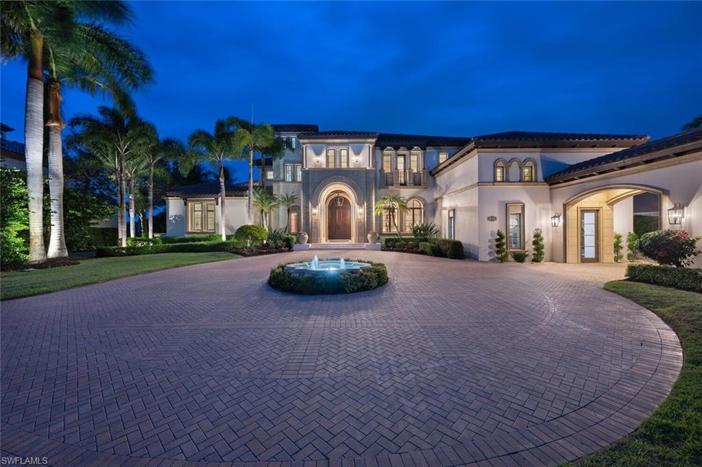 From the moment you enter, this home's expansive windows showcase stunning water and golf course views creating sophisticated elegance and warmth. Located in the prestigious sought after Isle of Royale neighborhood with interiors by Clive Davis this home presents a harmonious blend of classic beauty and warmth. Timeless and grand meet modern elegance in this 7 bedroom home. The owner's suite is a serene sanctuary with sitting area, well designed opulent closets, spa inspired bathroom, with well appointed adjacent study. The second level living area offers 5 en-suite bedrooms, one additional small bedroom, media loft, and supplementary laundry. A chef's dream, the kitchen with island, walk in pantry, Viking side by side refrigerators, 3 ovens and warming drawer, and small office off kitchen. This home boasts a theater, game room, and full bar. The outdoor living space provides inviting areas to enjoy sun or shade with summer kitchen and fire pit. The 4 car plus golf cart garages are finished out with 2 lifts, air conditioned, and work out area. A home that will exceed the expectations of the most discerning buyer.