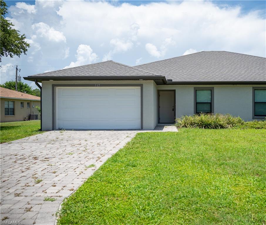 517 NE 24th PL in Cape Coral, FL is a three-bedroom, two-bath home featuring an open floor plan and tile flooring throughout. The property includes an automatic garage door and is located in an awesome neighborhood with a great location. Pets are allowed with approval. This residence offers a straightforward, low-maintenance layout ideal for those seeking convenience and easy upkeep.