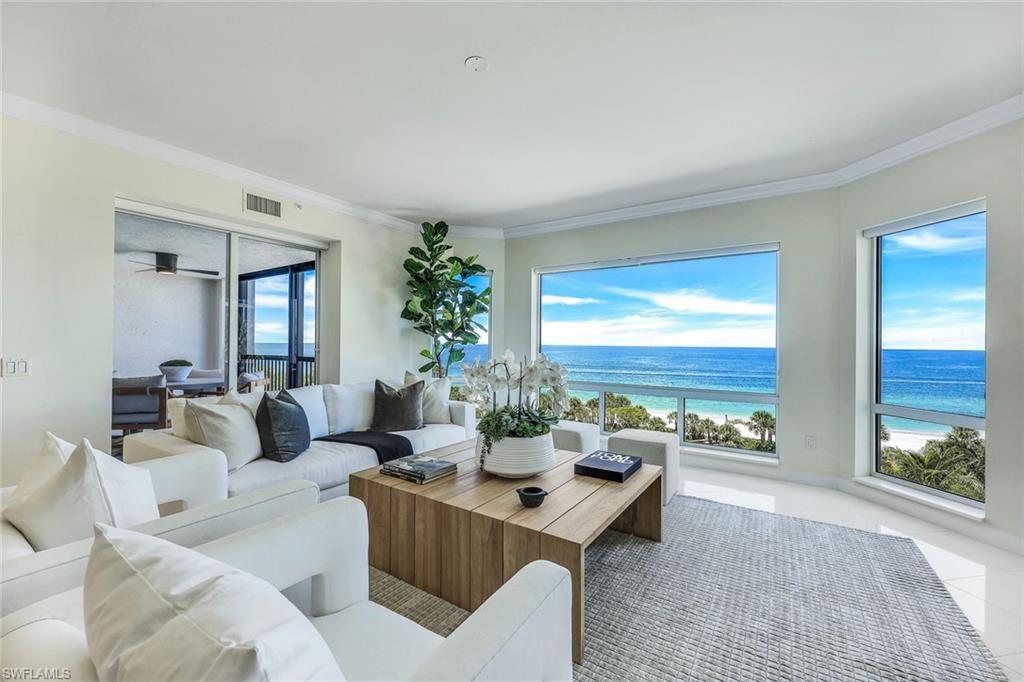 Redesigned and intelligently reimagined this extraordinary beachfront home now boasts a modern open living/dining/entertaining space, new breakfast/snack bar, four bedrooms and is in effortless move-in condition. Brilliant riveting gulf and beach views are ever present sunrise to sunset from its enviable fifth floor perch. You’ll be dazzled by the Biltmore’s stunning new Pool Deck showcased by the celebrated Naples coastline epitomizing upscale seaside living. Gleaming white marble flooring flows through the entire home highlighting the exceptional interior design that was previously crafted in the sleek kitchen and gorgeous primary bathroom by Naples Kitchen and Bath. Encompassing over 3,600 sq. feet including three lanais, family and friends can gather and relax comfortably and enjoy this exclusive yet casual lifestyle. The Biltmore is also undergoing an exceptional exterior renovation that will transform its Entrance into a world-class resort. All assessments have been paid. Bay Colony personifies laid-back luxury with its private beach access, attended service, members only restaurant and tennis courts all accessed through a stately secure guarded entry. Set within SWFL's most desired waterfront community, Pelican Bay, residency includes additional membership to its array of outstanding amenities.