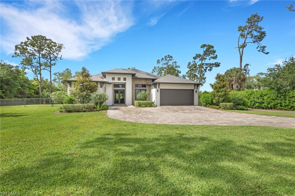 Discover the perfect blend of privacy, space, and modern comfort in this beautifully maintained home situated on 1.25 acres in Naples. Built in 2018, this spacious residence offers over 2,400 square feet of living space with 3 bedrooms plus a den, 2 bathrooms, and a thoughtfully designed open-concept floor plan ideal for both everyday living and entertaining.
The well-appointed interior features generous living areas, abundant natural light, and a versatile den that can serve as a home office, media room, or guest space. A whole-home reverse osmosis water system provides exceptional water quality throughout the property.
Step outside and enjoy the beautifully landscaped grounds, where mature plantings and lush greenery create a peaceful, private setting. With 1.25 acres of land, there is plenty of room to add the custom pool of your dreams while still maintaining ample outdoor space for recreation and relaxation.
Best of all, there are no HOA fees, restrictions, or assessments, offering the freedom and flexibility that are increasingly hard to find in Naples. This hidden gem combines the tranquility of estate-style living with the convenience of being located near shopping, dining, beaches, and everyday amenities. Families will appreciate the property's location within a highly sought-after district zoned for A-rated schools.
Whether you're looking for room to grow, space to entertain, or simply a private retreat to call home, this exceptional property delivers it all.