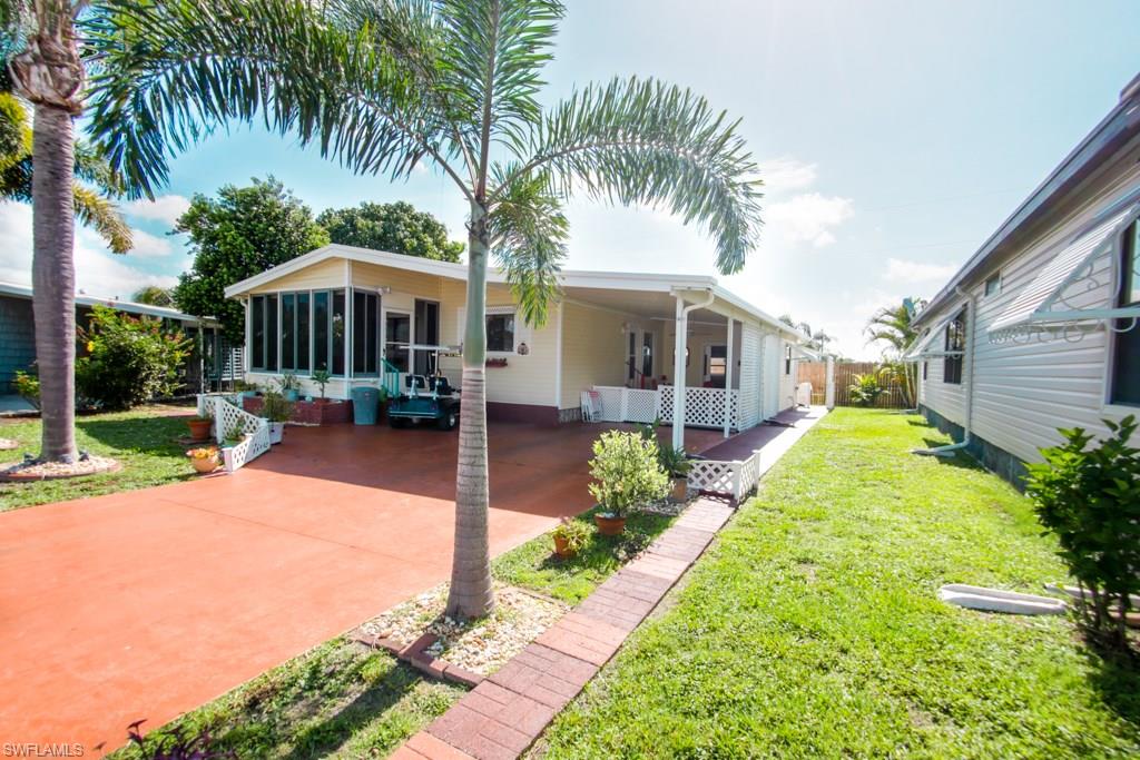 Great 2 bedroom, 2 bath home in a well kept and maintained 55+ community and RV park!  Very private, fenced in on 3/4 of the property- This home has lots of natural sun light making this charming home very welcoming.  The lanai doubles as a 3 season porch- Laundry is in your carport area which also doubles as a storage room with plenty of drawers and shelving. Brand new fridge, less than a month old, and a brand new washing machine! Tons of amenities: Laundry Facility, Seasonal Activities, Free Wifi, Full Hookup, Restrooms, 3 Heated Pools, a Dog Park, Community Room, Exercise Room, Billiards, and so much more.  Get around on foot or by your very own golf cart!  Very friendly neighborhood, pet friendly, too. Community share is included in the sale!