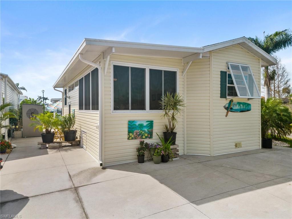 Welcome to your slice of paradise! This turnkey, 2 bedroom, 1 bath corner unit located in Holiday Condo is just 3 miles from Fort Myers Beach and is the perfect place to call home. As you step inside you'll find plenty of windows with Bahama shutters and ceiling fans throughout, providing a cool and comfortable atmosphere. The vinyl flooring makes for easy cleaning while the washing machine in-unit adds convenience. With ample outdoor storage and sheds available, you'll have all the space you need for your belongings. The community amenities are where this condo really shines! Enjoy two pools (indoor & outdoor), a tennis court, bocce ball court and shuffleboard – something for everyone to enjoy! Plus with low HOA fees that include water, trash, lawn maintenance. it's truly worry free living at its best. And last but not least is the friendly neighbors that make this area so serene - it's sure to be love at first sight!