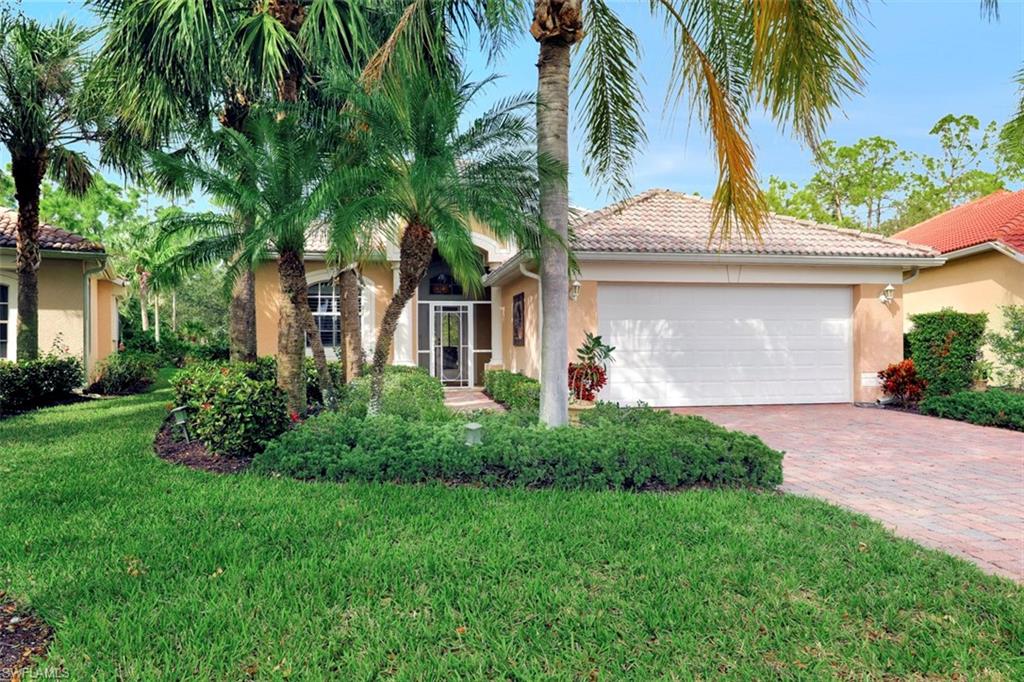 H.14697 - Gorgeous Lancaster Model Single family pool home featuring 3 bedroom plus a den, 2 full bathrooms and formal dining room with private preserve view. Special features include a brick paved driveway & walk way, screened front entry, volume ceilings, open concept floor plan with wood flooring in the living areas & master bedroom. Cork flooring in the kitchen area, Stainless Steel appliances, white cabinetry with crown molding and breakfast bar featuring granite counter tops make this kitchen a great spot for entertaining. Some other upgrades include: Plantation shutters on all the windows, soaking tub in the master bath, updated lighting fixtures, utility tub and overhead shelving in the laundry room. Enjoy the outdoors on your spacious covered lanai overlooking the pool with private preserve view. Amenities include a club house with pool & spa, tennis courts, bocce courts and a fitness room for residents. You are close to restaurants, shopping and beaches from this desirable North Naples location.