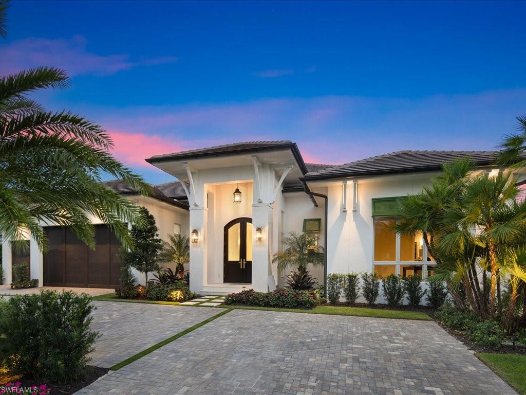 This stunning, 5 Bed/5 1/2 Bath home welcomes you with luxurious British Colonial architecture, combining Naples living with old world elegance. The foyer boasts a black & white marble pathway into this grand residence with intricately carved moldings & rich gold hardware, accenting the dark wood appointments repeated throughout the home. Located in the highly coveted Moorings neighborhood of Naples, this home is thoughtfully designed for both lavish entertaining & family living. A fluted wood island with turned legs accompany the rich, white cabinetry and lux marble counter tops in the spacious kitchen. Large, pocketed sliding doors lead to an opulent gathering room & over 800 square feet of living/dining space & a 36' pool & spa. The master bath features cane details & beautiful marble flooring. The lavish Cabana/Guest Suite offers an escape within the home's own unique architectural adventure to the past brought to present. Just a short golf-cart ride or walk to the shops & restaurants of Venetian Village & to the most beautiful private beach access in Naples at Moorings Beach. Architecture by Falcon Design, Suzanne Costa Interiors & masterful construction by Waterside Builders.