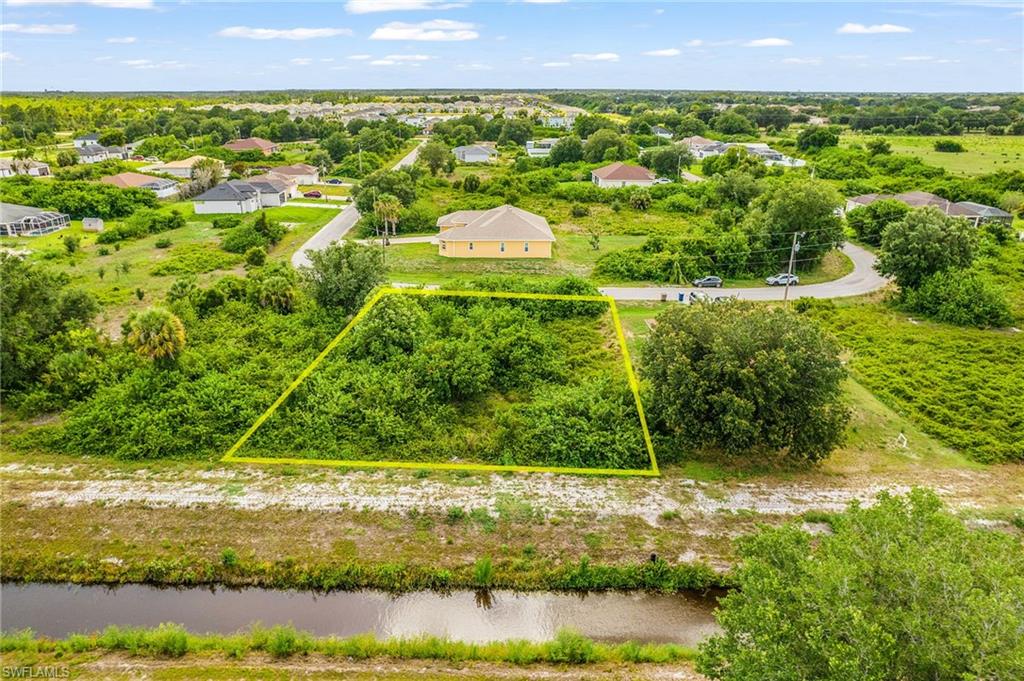 Rare opportunity to own a prime residential lot in the heart of Lehigh Acres' highly sought-after 33974 zip code, one of the most active land markets in all of Florida! Nestled in the established and rapidly developing southwest corridor near the Fort Myers border, this lot puts you right where the action is without sacrificing the peaceful, open feel that makes Lehigh Acres so desirable. No HOA. No CDD. No restrictions. Build on your timeline, your way.
Surrounded by new construction and located in a quiet neighborhood, this property is the perfect canvas for your custom home, complete with room for a pool and outdoor Florida living. Electric service is available, and the lot sits in a growing area where values continue to rise, making this a smart buy whether you're planning to build now or hold as an investment.
Commuters and families will love the location, just minutes from SR-82, Homestead Road, and RSW International Airport, with easy access to all of Fort Myers' shopping, dining, and entertainment. Mirror Lakes Elementary School is right in the neighborhood, making this an ideal spot for families putting down roots.
Whether you're a first-time land buyer, a seasoned investor, or a builder looking for your next project this is the opportunity you've been waiting for in Southwest Florida's sunshine corridor.