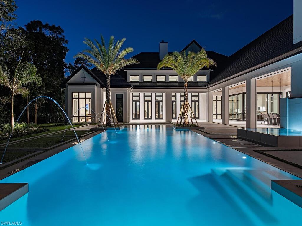 Located in Coach House Estates is this custom, French-inspired home on over 2.3 southern exposure acres. Formulated by Unique Hite Designs, fastidiously crafted by the Glendale Group of SWFL, and tastefully appointed by Alex Zapirain Designs. With over 8,000 AC sq.ft on one level in the main home and nearly 2,000 AC sqft. in the full guest house this property is a true estate. In the main home; 5 en-suite bedrooms, 6.5 baths, climate controlled 5-car garage(with room for car lifts plus 2 additional spaces in the guest house garage), true gourmet kitchen, full prep-kitchen, wine room, butler’s pantry/wet bar, and stunning outdoor covered and uncovered living areas. A tasteful blend of contemporary touches with timeless European heritage this home exudes thoughtfulness and quality.