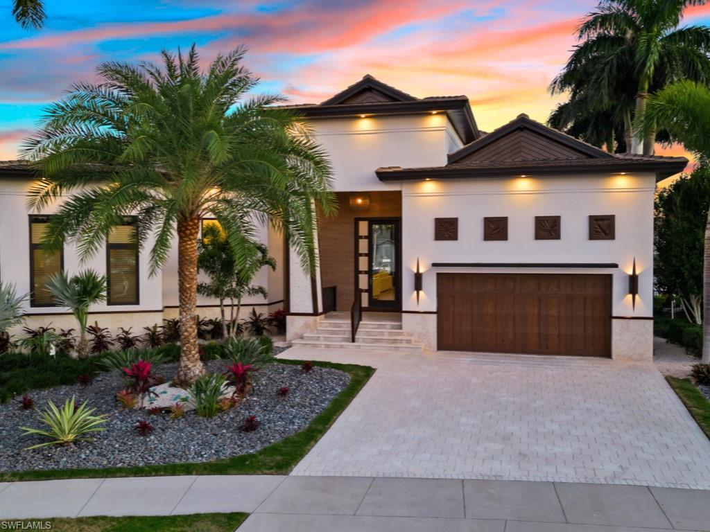 Welcome to ''Kahua'', a truly special property. A rare opportunity to acquire a piece of Paradise. This luxury resort home built by Paradise Design Build is a one of a kind architectural masterpiece, with attention to detail throughout. The extensive newly refurbished combined living and outdoor areas boast approximately 5000 SQ. FT. on an unique key lot with views on the extra wide waterway. The superior construction and quality of Kahua meets LEED Gold and ADA standards. The thoughtful design elements creates an inviting and intentional space to relax, entertain, live and enjoy! The home offers state of the art impact doors and windows, 12' glass sliding pocket doors that open to the outdoor space, electric hurricane shutters, 500 gallon propane tank, new interior design package and appliances, 56 ft lap pool with additional sundeck and jacuzzi and so much more.