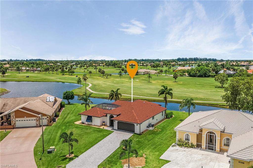 Step into your 1,805 square foot golf course home situated on an oversized lot with over 14,500 square feet. Plenty of room to expand your space or remain as is in luxury comfort. MOST AFFORDABLE HOME IN CAPE ROYAL! On the water with a beautiful 180 degree view of the #9 Fairway! Wide open is the scenery overlooking acres of golf course and water! Home sits on a cul-de-sac! When you enter the home you are greeted by a beautiful 21x35 courtyard and pool! In the courtyard is a separate en suite for guests that like more privacy. The kitchen is high end, all wood cabinetry, granite, stainless steel appliances including double convection ovens, WOW! New Roof in 2022, Driveway and Entrance Pavers 2021, New Double Front Entry Doors, New lanai cage, screens and gutters, Interior and Exterior just painted, New Bahama Shutters, New Ceiling Fans, New Blinds and Interior Shutters, New Interior and Exterior Oil Rubbed Bronze Door Hardware, New Faucets, New Light Fixtures and Dimmers and so much more. List of improvements is available. In Cape Royal you pay county taxes, not city, this significantly reduces your taxes. Serious buyers encouraged to make this home your own!
