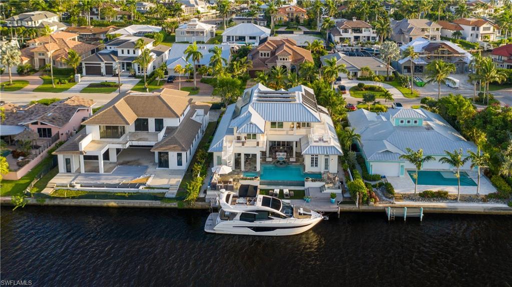 H. 16393 -Perhaps one of the most expertly crafted homes available. Winner of the Sand Dollar award for Most Sustainable and Smart Home by the Collier Building Association.  Built by BCBE homes, and Design West as the Interior Designers.  At nearly 5,000 sq. ft. the owners spared no expense in creating the ultimate entertainer’s dream. Open living spaces with soaring ceilings, large picture impact windows and doors throughout the home provide the ultimate sense of indoor-outdoor living. The custom kitchen was designed with top of the line appliances, custom cabinets, stone counter tops. Reclaimed wood flooring from a Guinness factory with inlaid stone are throughout the first floor. The master wing has spectacular views from both the bedroom and bathroom. Upstairs are four guest suites and a wrap around deck for spectacular sunset viewing. An infinity edge pool, fire bowls, custom boat dock and outdoor kitchen ensures that all who visit will overstay their welcome. Solar panels, grey water harvesting, Tesla 80 amp. charging station and the highest grade of Icyene insulation make this a home for now and the future.