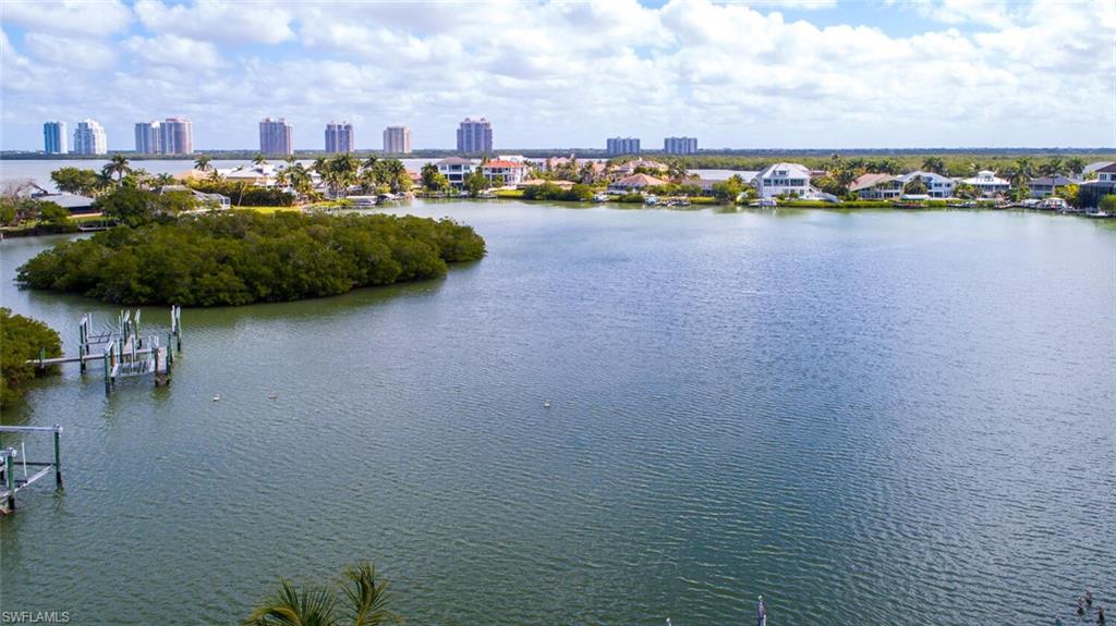 ONE OF BONITA BEACH’S BEST BAY LOTS NOW AVAILABLE! This nearly half-acre lot is an oversized/extra deep parcel with panoramic views of Estero Bay & a perfect location less than a 2-minute walk to the sugar sands of Bonita Beach. Enjoy a 5-minute boat ride to the Gulf of Mexico from your future private boat lift. Best of both worlds—beach & boating! Price is for vacant land only—however the property can also be purchased as a pre-construction package with plans to build with your choice builder OR with the coveted team of award-winning “Potter Homes” & “Adelyn Charles Interiors” at the ready. Plans available for a state-of-the-art 5,400+ sq ft, 5 bedrooms + den, 5.5 bath home with infinity edge pool/spa & garage with room for 6+ cars. Your dream home awaits you! Walking distance to several fantastic restaurants and a 10-minute drive to Mercato and the Promenade, with Waterside Shops, Coconut Point, 5th Ave, and the International Airport nearby.