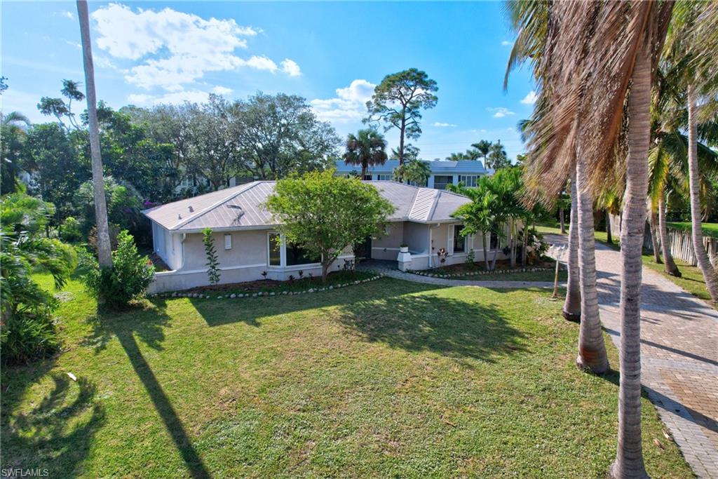 Ranch style home with 3 bedrooms and 2 baths, and a one car garage with a huge, screened porch area perfect for entertaining. Great location on a cul-de-sac in one of the most sought-after neighborhoods in North Naples, this residence sits on an oversized lot in Palm River Estates.  Centrally located just 10 mins from the white sand beaches, fine dining and shopping. No HOA.