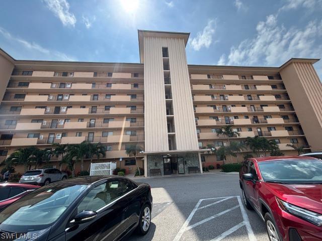 REDUCED!!! SELLER WILL ENTERTAIN ALL OFFERS! . Overlooking the Caloosahatchee River and expansive intersecting canals, this meticulously maintained second-floor condo is move-in ready. Featuring uniform tile flooring throughout, the layout offers two spacious primary suites and a bright, open kitchen. The living area and private lanai boast stunning southwestern exposure with water views visible from every window. Both bathrooms have been tastefully updated to be light and airy. The unit includes a large utility room with stackable laundry and extra storage. River Towers amenities include a riverside heated pool, a shaded tiki area, community rooms, a library, and shuffleboard. Boat docks and lifts are available through the HOA on a first-come, first-served basis. Residents enjoy a designated parking spot, a private 10x10 ground-floor storage unit, and access to community laundry for oversized loads. Located within walking distance of Jaycee Park and the scenic bike paths of Beach Pkwy, this 55+, pet-free, and non-smoking community is the perfect year-round residence or seasonal retreat.