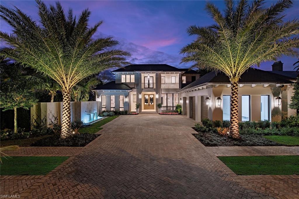 VIV Homes, in collaboration with Kukk Architecture, has created an extraordinary new construction residence offering ultra-rare, commanding wide-water western sunset views over Man of War Cove in Port Royal.
This home, truly beyond compare, is a masterpiece of design and craftsmanship, with nearly 8,500 square feet of living space. The expansive floor plan includes 5 bedrooms, plus a study, and a luxurious upstairs VIP suite, as well as 6 full bathrooms and 2 half baths. The property is designed for both grand entertaining and intimate living with a resort-like pool area featuring a swim-up bar, fire features, and custom Tuuci umbrellas. Every detail of this residence has been carefully considered, with no expense spared. A new 40-foot concrete floating dock provides convenient and quick Gulf access, completing this exceptional outdoor living space. The home features full concrete construction, limestone cladding, a slate roof with copper gutters, bespoke cabinetry, and Legno Bastone Lancaster wood flooring. Hand-selected natural stones elevate both inside and outside, while luxury Poliform Italian-made closets add sophistication to the bedroom suites. The home is equipped with the latest in technology, including a Lutron Homeworks system, Sonos sound, security, and automated screens and shutters. Additional highlights include a service kitchen, wine wall, infinity-edge pool, built-in fire pit, and a Renson motorized trellis. With 3 air-conditioned garages and every modern convenience integrated seamlessly into the design, this residence offers the ultimate in luxury waterfront living.This is a rare opportunity to acquire a truly exceptional property in one of the most sought-after locations in Port Royal. This home represents the pinnacle of luxury living, and is an opportunity not to be missed.