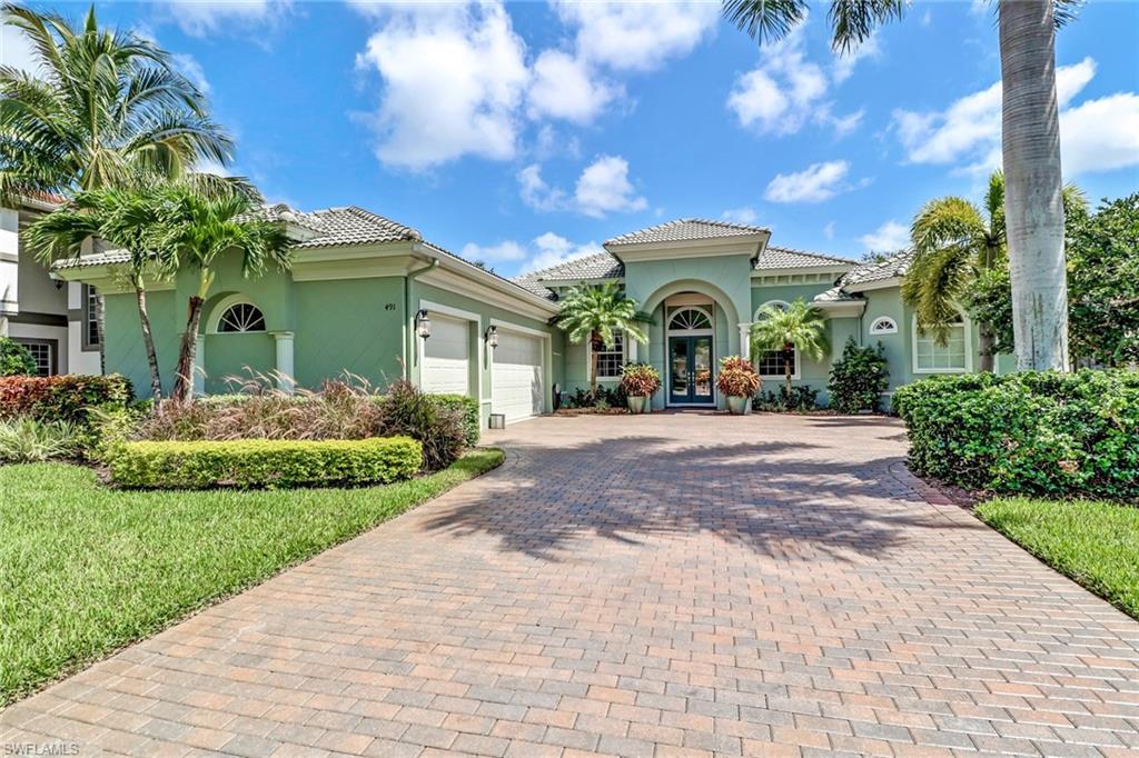 This property was a former, upscale model in a secluded location in North Naples. It has an open floor plan including an electric fireplace and is great for entertaining. Full opening sliders lead you out to the covered lanai and fenced back yard.  The gourmet kitchen features soft close drawers, slideouts in lower cabinets, and the island is tile sided! Refrigerator, washer, and dryer are all new! The master bedroom has french doors leading out to the lanai and the fourth bedroom has a private bathroom and a door directly out to the heated salt water pool! The pull-down attic stairs are located in the 3 car garage which has tile flooring. This home also features electric storm shutters that isolate the lanai and the front door has an electric roll down shutter. Plans for a new roof to be installed in progress. The Buyer still has time to pick a new roof!