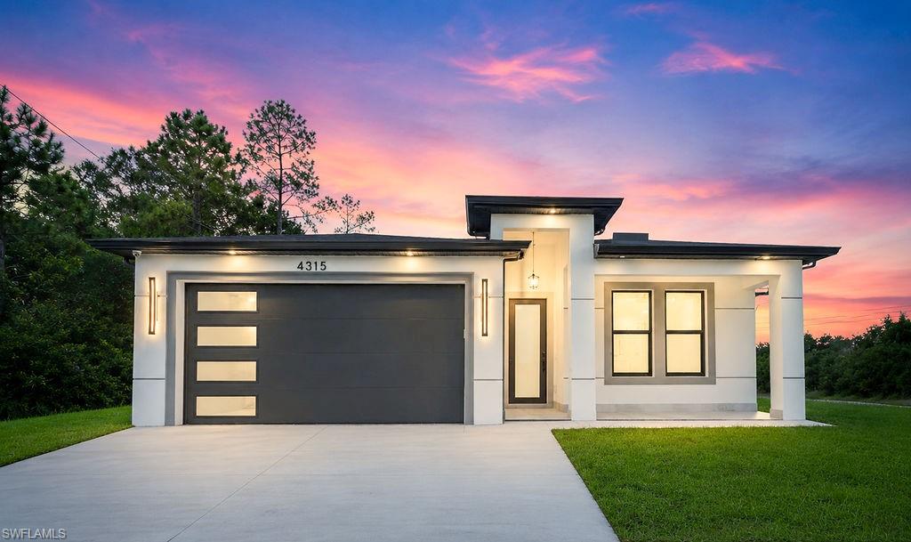 Welcome to this Brand-New 2025 Construction on a Desirable Corner Lot!
This stunning newly built home located in one of the fastest-growing and most desirable areas of Lehigh Acres. Conveniently situated just minutes from Gunnery Road, Lee Blvd and Daniels Parkway, this exceptional corner-lot property offers easy access to shopping, dining, schools, entertainment, and major roadways, making commuting to Fort Myers and surrounding areas effortless. Designed with modern elegance and superior craftsmanship in mind, this home features beautiful marble-look tile flooring throughout, creating a seamless flow and sophisticated aesthetic in every room. The spacious open-concept floor plan is complemented by soaring high ceilings that enhance the home’s bright, airy atmosphere and allow natural light to fill every corner.
Built for both beauty and durability, the home is equipped with impact-resistant doors and windows, providing enhanced storm protection, energy efficiency, and peace of mind. The premium energy-efficient windows are designed to help reduce heat transfer and minimize direct sun exposure, keeping the interior cooler and more comfortable year-round while contributing to lower utility costs. Luxury touches continue throughout the home with modern electric window shades, offering convenience, privacy, and a sleek contemporary finish at the touch of a button. The thoughtfully designed floor plan maximizes functionality and livability, creating an amazing distribution of space that feels both spacious and inviting.
The property is also pool-ready, with electrical connections already installed and prepared for a future pool, providing an excellent opportunity to create your dream outdoor retreat.
Situated on a desirable corner lot, this home offers additional privacy, enhanced curb appeal, and extra outdoor space compared to many neighboring properties.
Built with efficiency and long-term value in mind, this home offers a low cost of ownership thanks to its impact-resistant windows and doors, modern construction standards, energy-efficient features, and low-maintenance finishes. Buyers can enjoy potential savings on insurance, utilities, and future maintenance costs compared to older homes. Please note that the specialty kitchen appliances currently shown in the home were custom-selected by the owner and will be replaced with brand-new standard appliances prior to closing.
Outside, the property showcases premium lawn, providing a lush, vibrant grass that enhances the home’s curb appeal and creates a beautiful outdoor setting. The modern exterior design and attractive curb appeal make a lasting first impression. Every detail of this brand-new 2025 construction has been carefully selected to combine luxury, functionality, efficiency, and lasting value. Whether you’re searching for your primary residence, a seasonal retreat, or a smart investment opportunity, this home delivers exceptional craftsmanship in a prime location.