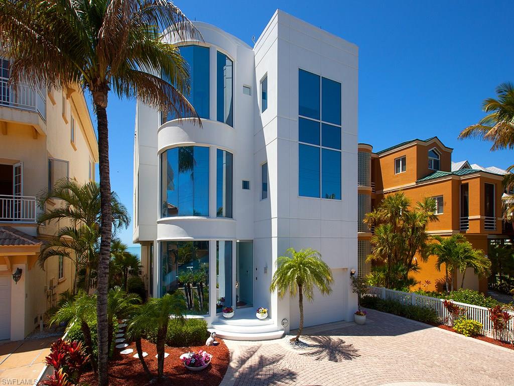 This contemporary masterpiece is breathtakingly beautiful and has a spectacular rooftop terrace with panoramic views from Naples to Sanibel. This home features reinforced concrete construction and was designed by Randall Stoft and built by Lifestyle Concepts. Features include elevator, dumbwaiter, white marble floors throughout, a 1,100-square-foot master suite with floor-to-ceiling windows, huge closet with washer and dryer, and refrigerator, two guest suites, three full baths, two half baths, pool and spa.
