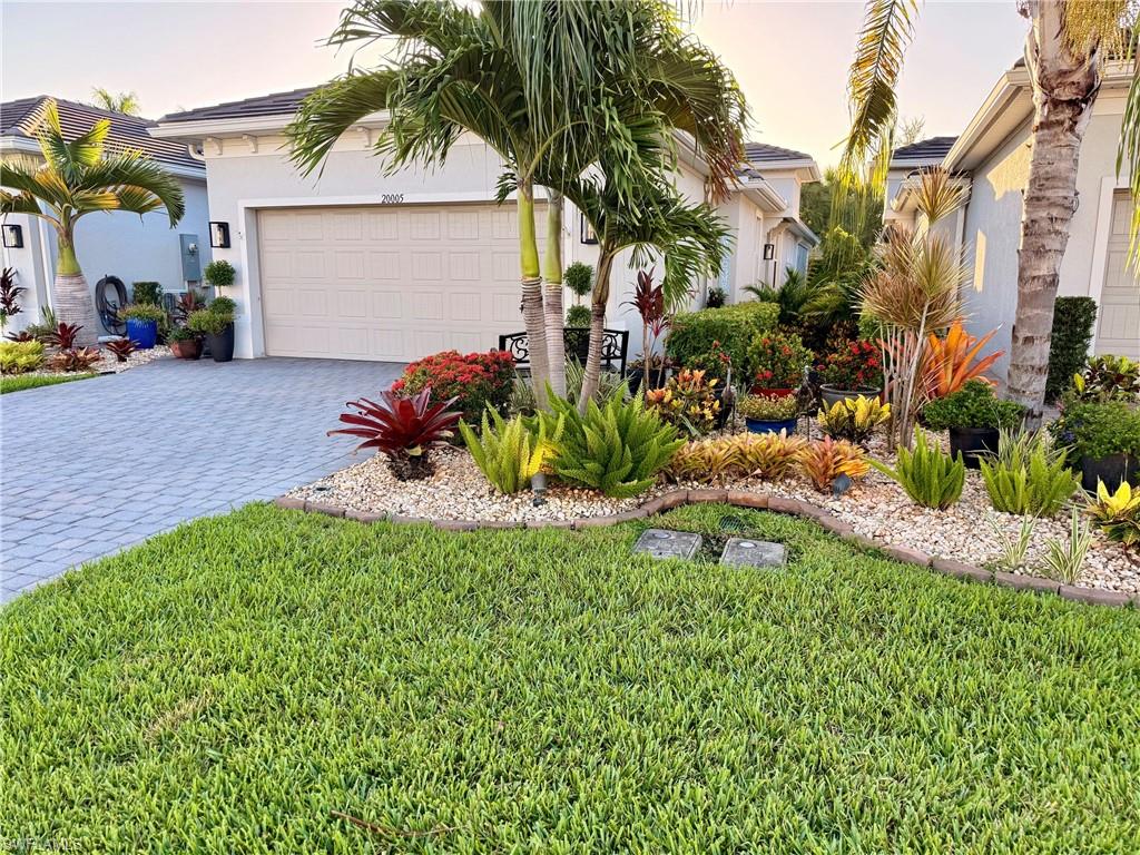 Talk about a total showstopper! Tucked away in Tidewater—Estero’s premier gated 55+ community by Del Webb—this majestic, newly built luxury villa offers an unparalleled turnkey lifestyle. Radiating "like-new" sophistication, the home boasts gorgeous curb appeal, high-end custom renovations, and professional staging designed to completely captivate the most discerning buyer.
PREMIUM FEATURES & UPGRADES:
 Living Space: An expansive, sun-drenched open-concept floor plan connects the main living, dining, and a chef-inspired kitchen featuring gleaming quartz countertops, pristine flooring, and premium appliances in both kitchen and laundry room. Entire interior is newly painted, the floors have been professionally cleaned, and all grout has been redone in the whole house.
 Flexible Layout: Features a spacious primary suite, a private guest wing with a separate bath, plus a highly versatile den/office easily serving as a 3rd bedroom.
 Ultimate Safety & Comfort: Fully equipped with electronic window shades. 
 The Ultimate Lanai & Patio: Fall in love with the spectacular screened lanai, upgraded with storm-graded full hurricane storm-surge electric screens on the lanai for peace of mind in a safe, secure gated environment. Step outside the lanai to an expanded, private paver patio surrounded by lush, manicured gardens.
 Advanced Drainage Infrastructure: Both the front and backyard feature newly upgraded, custom French drains, ensuring the pristine grounds and landscaping stay beautifully and adequately drained year-round.
 Oversized Garage: 2-car garage with immaculate, freshly epoxied floors—perfect for your SUV, bikes, and a golf cart. Widened Extended driveway.
Forget about yard work—maintenance is fully handled by the HOA, keeping your lawn green and beautiful. Enjoy a premier location where you can walk to nearby shopping and trending dining, with the airport just minutes away. Tidewater's world-class amenities include a 2-story 13,000 sq. ft. clubhouse, Activities Director, fitness center, library, Olympic-size resort pool, BBQ cabana bar, tennis, pickleball, bocce, a dog park, and community gardens. Safe, sophisticated, and completely irresistible—welcome home!