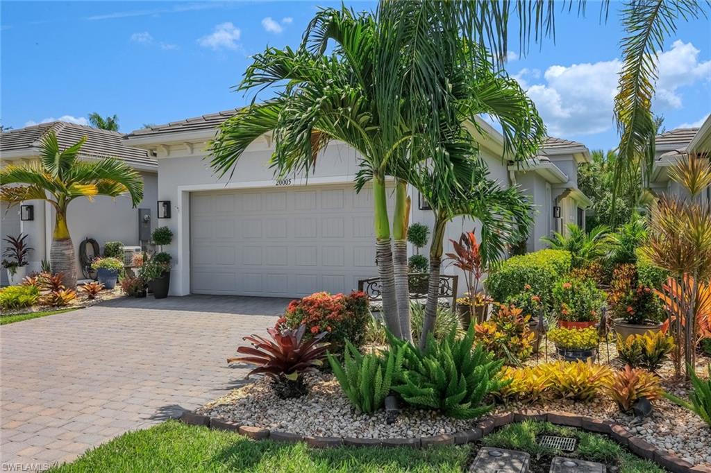 Talk about a total showstopper! Situated away in Tidewater—Estero’s premier gated 55+ community by Del Webb—this majestic, newly built luxury villa offers an unparalleled turnkey lifestyle. Radiating "like-new" sophistication, the home boasts gorgeous curb appeal, high-end custom renovations, and professional staging designed to completely captivate the most discerning buyer.
PREMIUM FEATURES & UPGRADES:
 Living Space: An expansive, sun-drenched open-concept floor plan connects the main living, dining, and a chef-inspired kitchen featuring gleaming quartz countertops, pristine flooring, and premium appliances in both kitchen and laundry room with laundry sink and cabinetry. Entire interior is newly painted, crown molding through, the floors have been professionally cleaned, and all grout has been redone in the whole house.
 Flexible Layout: Features a spacious primary suite, a private guest wing with a separate bath, pocket door for separation, plus a highly versatile den/office easily serving as a 3rd bedroom includes French doors for privacy.
 Ultimate Safety & Comfort: Fully equipped with electronic window shades. 
 The Ultimate Lanai & Patio: Fall in love with the spectacular screened lanai, upgraded with storm-graded full hurricane storm-surge electric screens on the lanai for peace of mind in a safe, secure gated environment. Step outside the lanai to an expanded, private paver patio surrounded by lush, manicured gardens.
 Advanced Drainage Infrastructure: Both the front and backyard feature newly upgraded, custom French drains, ensuring the pristine grounds and landscaping stay beautifully and adequately drained year-round. Professionally installed lush landscaping surrounds the home.
 Oversized Garage: 2-car garage with immaculate, freshly epoxied floors—perfect for your SUV, bikes, and a golf cart. Widened Extended driveway.
Forget about yard work—maintenance is fully handled by the HOA, keeping your lawn green and beautiful. Enjoy a premier location where you can walk to nearby shopping and trending dining, with the airport just minutes away. Tidewater's world-class amenities include a 2-story 13,000 sq. ft. clubhouse, Activities Director, fitness center, library, Olympic-size resort pool, BBQ cabana bar, tennis, pickleball, bocce, a dog park, and community gardens. Safe, sophisticated, and completely irresistible—welcome home!