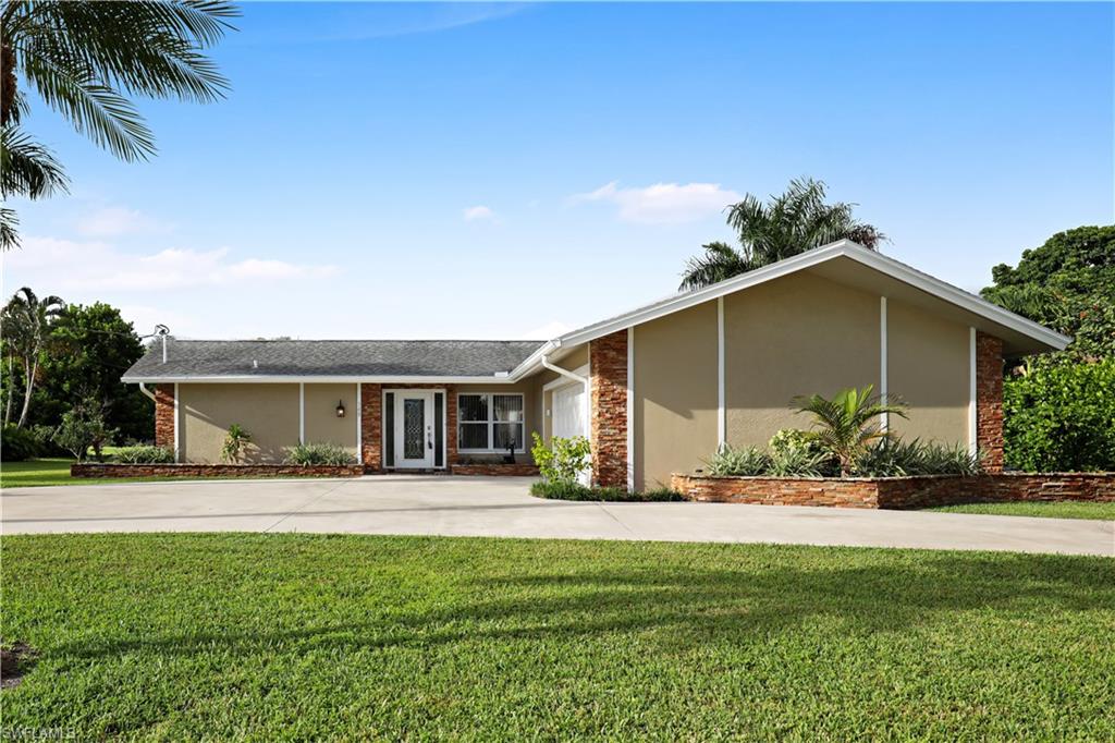 Beautiful, golf course lot, fully remodeled home with pool and spa. Contemporary features, finishes and fixtures throughout including hardwood floors. Great neighborhood location with a stunning fairway view and no cart path near the property. Screened lanai with beautiful in ground pool and free-standing spa make outdoor entertaining easy and enjoyable. Circle drive and side facing two car garage are only two of the unique features of this home. Home is in impeccable condition and shows beautifully. Attractively priced and Sellers are motivated.