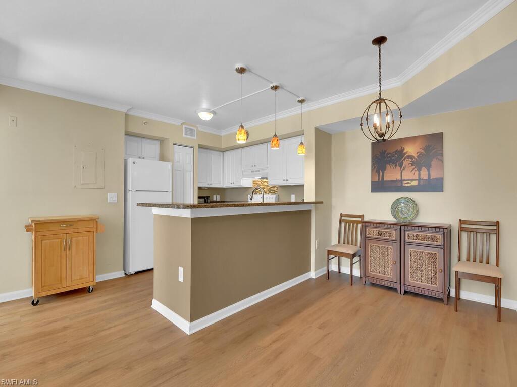 The Enclave at Naples, looking for a great location close to downtown Naples and easy access to I75? This is the perfect condo.  Nicely updated, no popcorn ceilings in this unit, crown molding and luxury vinyl plank flooring in the living area, and granite countertops. This 2 bedroom 2 bathroom condo has a spacious open plan and split bedrooms. Enjoying direct access on the first floor and a peaceful SW facing lanai overlooking a landscaped area. The Enclave offers many recreation options including tennis, racquetball, pool and fitness center.  This condo is move in ready.
