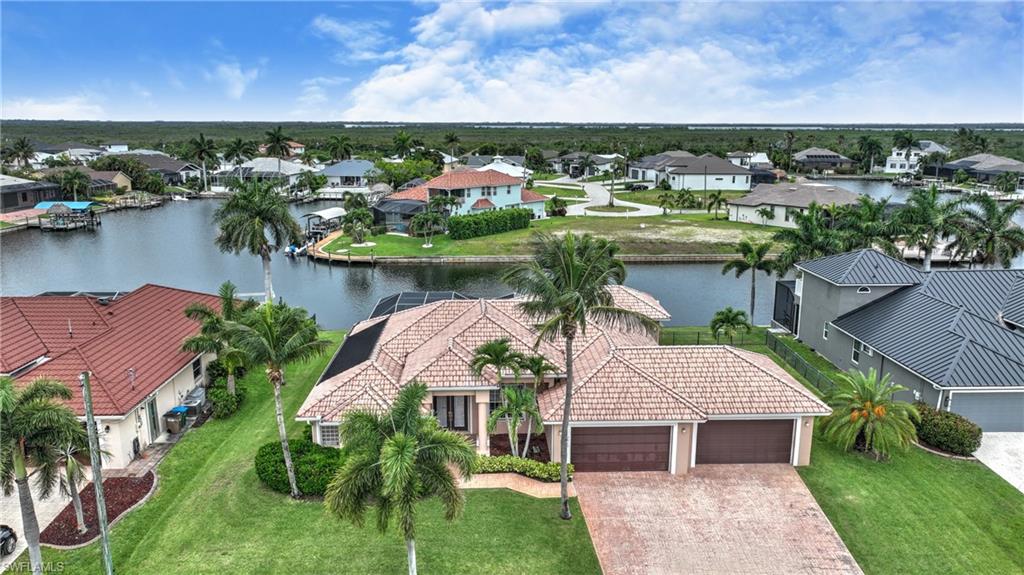 Wow, what an amazing property.  Intersecting canals, 4 car garage,  just minutes to the spreader canal.  Located in beautiful SW Cape coral, this home has amazing space.  3 bathroom connected to the 2 bedrooms, very large, den, living and dining areas.  Huge media room.  This home is ready for you to make it your own paradise.  Easy to show.