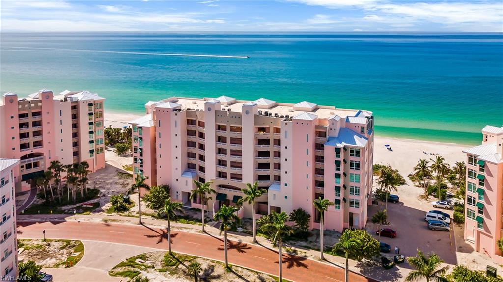 BEST VIEWS AND VALUE in Barefoot Beach Club. Every day is a beach day and every sunset unique in this DIRECT BEACHFRONT condo with panoramic Gulf views all the way to Sanibel Island. 

Experience luxury beachfront living: listen to the surf, collect shells, swim, relax and enjoy spectacular sunsets on more than 3 miles of white sand beach outside your door. Light fills this open plan, 3 bedroom, 3 full bath END UNIT, much more spacious than a 3 bedroom, 2 bath unit. There’s plenty of room to host family and friends in the expansive great room/dining area and beachside balcony. Kitchen features a large center island, high-end appliances, and breakfast room with unobstructed back-bay view to enjoy the morning sunshine. 

Walk out to the wrap-around screened balcony from the master suite and great room. Unique glassed-in section of balcony adds interior square footage and can be used as a Gulf-view office. Tile flooring, plantation shutters, custom lighting throughout, furnishings included. Includes ground level storage closet only available with end units. 

Upscale Barefoot Beach Club offers the most natural, uncrowded beach and relaxed lifestyle in prestigious North Naples/Collier County. Ownership includes a beachside pool and spa, fitness center, and manned gated entry. Minutes to upscale shopping and dining at Mercato, Waterside Shops, Coconut Point, cultural events/concerts, and downtown Naples. Exclusive, secluded location: there's no through traffic, far away from the congestion of other Collier County areas. Easy access to RSW International Airport. Take a drive down the brick paver boulevard and you'll see that nothing else compares at this price!