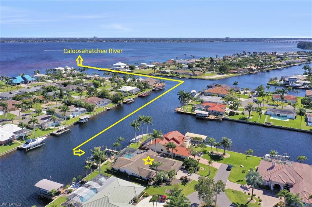 180’ Wide Canal with Intersecting Canal Views Just 2-minutes out to the River! Thoroughly renovated to an open, bright and modern living area. This impressive home compares favorably to new construction with its many updates including remodeled kitchen, bathrooms, flooring, and fixtures all done in hi-end finishes. Lanai sliders pocket inside the walls to  open up the flowing floor plan to the expansive pool area. A boater’s paradise, the desirable Palaco Grande neighborhood features deep wide canals and this home is no exception. Positioned in the center of a quiet Cul-De-Sac street with 87’ of canal frontage and 2 large boat slips plus a 12,000 lbs. lift. Just a few impressive features to this home are its Atrium entry with natural rock waterfall, open and flowing floor plan, volume ceilings with lots of windows throughout taking full advantage of the natural sunlight and dramatic water views, over-sized garage with an abundance of attic storage, dual zoned A/C system, Plantation Shutters, and much more… This truly feels like a new home!more… This truly feels like a new home!