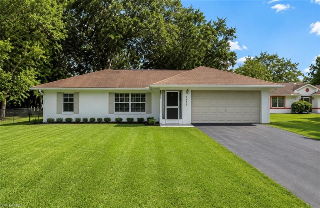 One or more photo(s) has been virtually staged, AI generated or rendered.  LOCATION, LOCATION, LOCATION! Enjoy Estates living with city convenience!
Located right off Collier Blvd, this charming 3-bedroom, 2-bathroom single-family home offers the perfect blend of country freedom and urban accessibility. Situated on a cleared, 1+ acre lot, you’ll love the space and privacy of Estates living while being just minutes away from local grocery stores, dining, and gas stations.
Inside, the home features an inviting open floor plan concept enhanced by cathedral ceilings and large windows that flood the space with natural light. The functional split-bedroom floor plan ensures privacy for the primary suite, while the kitchen shines with a beautiful backsplash. Additional highlights include a 2-car garage and a massive, fully usable yard with endless room for your toys, RVs, boats, pets, and family outdoor fun!SELLER INCENTIVE: The sellers are generously offering a $10,000 credit to the buyer at closing, which can be applied toward closing costs or roof repair/replacement. Don't miss this incredible opportunity!