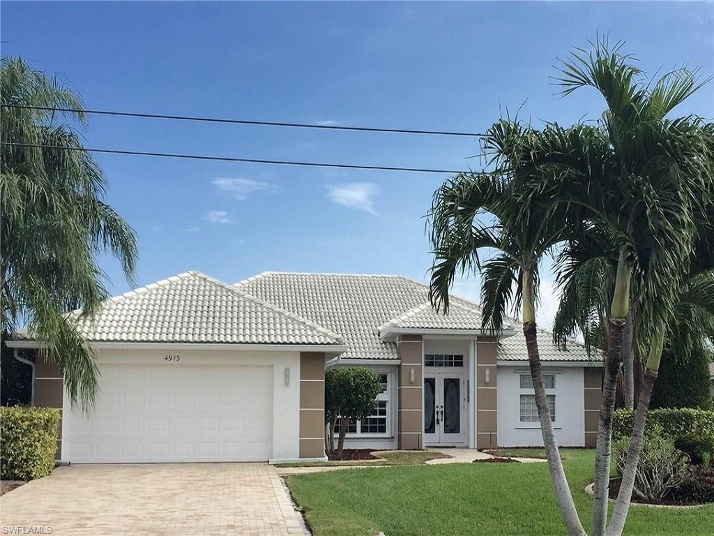 You'll love this direct access pool home with tile roof! Walk through front door and immediately see beautiful pool and canal.  Wonderful open floor plan with cathedral ceilings, tile floors and walkways, formal dining, beautiful breakfast nook with bayed mitered glass window.  Lovely kitchen with granite counters, breakfast bar, nice cabinets with new doors.  Bright and cheerful master bedroom with sliders to lanai and beautiful tray ceiling.  Nice master bath with double sinks, walk in shower with tile and glass block, nice dressing area, walk in closet, and two linen/reach in closet.  Nice sized pool bath with tiled shower. Both guest bedrooms have walk in closets.  Large lanai to fully enjoy!  Beautiful pool with cascading spa, electric heat, nice pool deck, and mansard cage.  Also sun patio off just outside screened cage.  Wooden boat dock ready for your sailboat!  Nice privacy hedge on sides.   Nice tile roof, beautiful brick pavered driveway, culvert installed at driveway, a/c replaced 2012, storm shutters (mostly accordion) for every opening except glass block window &  garage window.  Home comes furnished except for a few personal items! Easy to call home