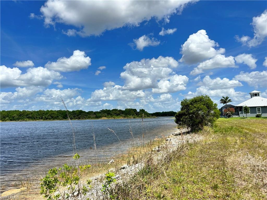 Exclusive multi-million dollar lake front home with picturesque lake views and private lake access. This elegant residence offers a rare blend of privacy, natural beauty and refined living—a true hidden gem in a tropical paradise. Enjoy amazing lake views from this cozy home featuring 4 bedrooms + Den and 4.5 baths. Tile flooring and attention to modern detail. The gourmet kitchen is a statement of contemporary luxury, featuring custom-designed cabinetry, and high-end finishes curated for the discerning chef. The opulent primary suite is a sanctuary of comfort and sophistication, complete with dual rainfall showers, a deep soaking tub, and refined lighting design to evoke a spa-like experience. Expansive sliding doors lead to a stunning outdoor oasis, where a heated pool and spa with wireless controls overlook the lake.
The lanai also includes an enclosure for a seamless resort-style experience. Additional highlights include hurricane-impact windows and doors, custom lighting throughout, a paver driveway, and a gated entrance for enhanced privacy and security.
Ideally located just minutes from CREW Bird Rookery Trails, Audubon Corkscrew Swamp Sanctuary, Big Corkscrew Island Regional Park, and everyday conveniences—this estate offers an unmatched lifestyle immersed in nature and luxury.
PERFECT FOR WEEKEND GETAWAYS OR RETIREMENT LIVING.. 60,000+ ACRE LAND BACKYARD IS A NATURAL RESERVE. BIRD ROOKERY SWAMP IS PRESERVED AND PROVIDES A SANCTUARY FOR AT LEAST 45 KINDS OF BIRDS, INCLUDING SOME PROTECTED AND THREATENED SPECIES.
BEAUTIFUL, PEACEFUL AND QUIET AREA.