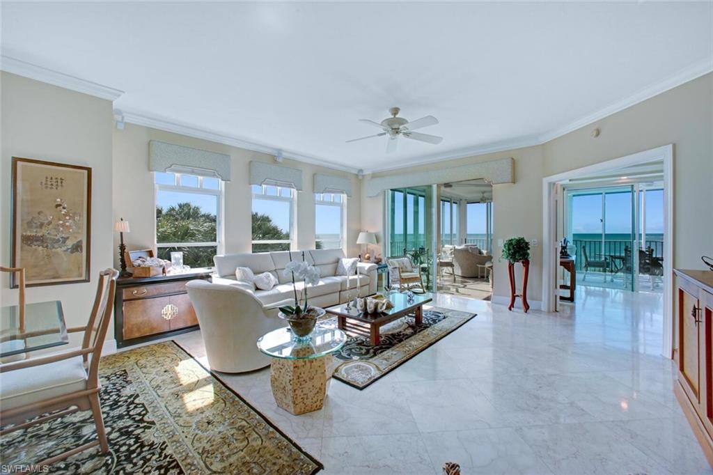 RARELY AVAILABLE 3 BED, 3 BATH END-UNIT IN NORTH NAPLES’ COVETED BAREFOOT BEACH CLUB! Enjoy endless SOUTHWEST Beach views, down the coast to Naples’, with breathtaking sunsets from your Gulf-front wrap-around lanai. This immaculately maintained beachfront retreat is finely appointed with high ceilings, gorgeous marble floors, and an air-conditioned panoramic lanai with automatic shades & screens, allowing you to enjoy the Gulf view either screened or open air – an incredibly rare feature in the Barefoot condos. Enjoy extraordinary natural light via extra windows that are only available in an end unit. Incredible entertainer’s kitchen with professional grade cabinets & granite countertops. Absolutely beautifully maintained, this pristine unit is neutral & move-in-ready. Nearby to the BRAND NEW CLUBHOUSE with state-of-the-art fitness center & resort-style pool. Barefoot Beach residents enjoy 3 miles of beach, 2 pools/spas, manned/gated entry & on-site mgmt. The OPTIONAL “Club at Barefoot” offers boat slips, tennis, 2 restaurants & beachside food/bev/chair service. Excellent Collier County location minutes to Mercato, Waterside & easy access to RSW Airport.