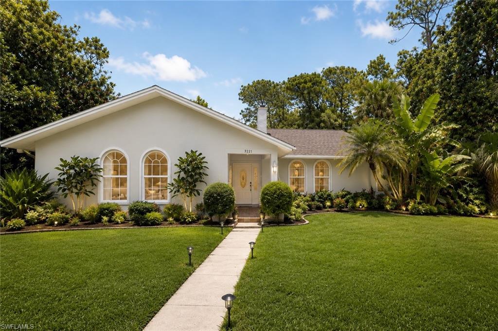 One or more photo(s) has been virtually staged, AI generated or rendered.  Discover the rare combination of privacy, acreage, and convenience in this beautifully maintained estate residence set on 2.27 lushly landscaped acres just minutes from Naples' world-renowned beaches, fine dining, shopping, and cultural attractions. Custom-built by its original owners and offered for the first time, this exceptional property presents a unique opportunity to enjoy a peaceful country setting without sacrificing proximity to the heart of Naples.

Designed for both comfortable everyday living and effortless entertaining, the residence features four spacious bedrooms, two baths, soaring volume ceilings, rich hardwood and tile flooring, and an abundance of natural light throughout. Recent enhancements include newly installed granite countertops in the kitchen, a beautifully updated primary bath vanity, fresh interior paint, professional exterior cleaning, and refreshed landscaping.

The outdoor living experience is equally impressive. A heated pool and spa serve as the centerpiece of the expansive screened lanai, creating a private tropical retreat surrounded by mature vegetation and wide-open green space. Multiple sets of French doors seamlessly blend indoor and outdoor living, inviting gentle Florida breezes throughout the home. On cooler evenings, gather around the wood-burning fireplace and enjoy the warmth and character it brings to the main living areas.

Additional features include a whole-home water filtration system, integrated intercom and sound system, Bahama shutters, and an oversized fourth bedroom that offers the flexibility to create a fifth bedroom, media room, or private guest suite. With ample room for expansion, recreational amenities, guest quarters, or equestrian pursuits, this remarkable property offers endless possibilities.

A rare offering where acreage, privacy, and location come together in one exceptional Naples address.