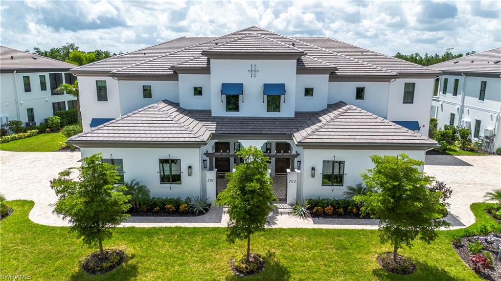 Introducing Nerano, a new coach home neighborhood by Front Door Communities located within the award-winning Miromar Lakes Beach & Golf Club. This limited collection features 10 buildings with four residences each. With 3 homes available for occupancy by March 2026. And 4 Homes ready by November 2026 
This designer-coach home offers a private entrance, open-concept great room, volume ceilings, and a gourmet kitchen with large island. The floor plan includes 3 bedrooms and 3.5 bathrooms, a screened lanai with serene lake and preserve views, and an attached 2-car side-entry garage. Buyers may select from ground-floor or top-floor configurations Top floor offers a private den and choose from available customization options. Furniture package available at additional cost.
Residents of Miromar Lakes enjoy access to a 700-acre freshwater lake, 3 miles of white-sand beach, a 10,000 sq. ft. zero-edge infinity pool, three onsite restaurants, European spa and salon, fitness center, tennis, pickleball, bocce, racquetball, and the Arthur Hills Signature Championship Golf Course. Concierge services and an extensive lifestyle program complete this exceptional community.