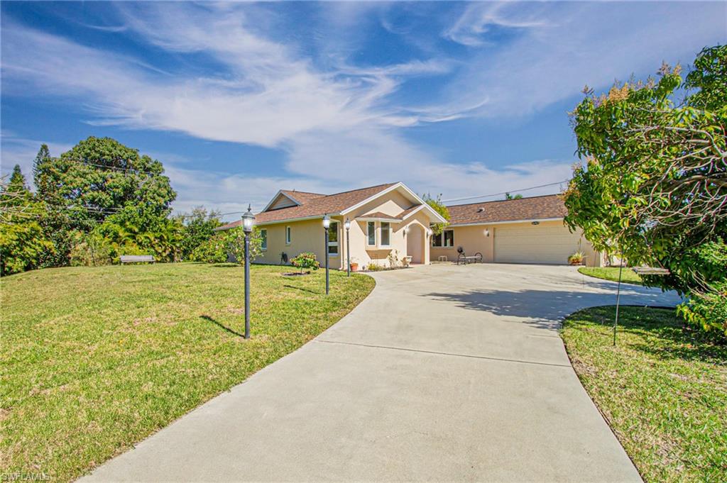 Experience the epitome of Southwest Florida living in this charming single-family home, ideally situated in a private cul-de-sac on a high-elevation third of an acre lot. Located in a serene neighborhood without HOA, just a short stroll from downtown Old Bonita, this custom-built residence exudes Mediterranean-inspired style.The original owners thoughtfully designed the home, featuring cathedral ceilings, an open-concept living area & five sets of French Doors leading to a enclosed patio for additional living space. Step outside to a generous 720-square-foot screened lanai,a perfect setting for outdoor living and entertainment in a tranquil environment.The property boasts a well-designed split floor plan, double-car garage and a long driveway, suitable for a boat or RV. Upgrades include, washer & dryer 2024, heater 2024, master bathroom's vanity 2024, water heater 2023, irrigation pump & timer 2022, newer roof 2017, custom wood kitchen cabinets 2015, impact-resistant double-pane casement windows 2011 and a 30 foot private well for irrigation. Easy access to I-75&SWFL International airport and a mere 10-minute drive to the beautiful Bonita Beaches, making this property an ideal choice for investors, families or seasonal residents. Seize the opportunity to witness all that this delightful home has to offer – an invitation to Southwest Florida living at its finest.