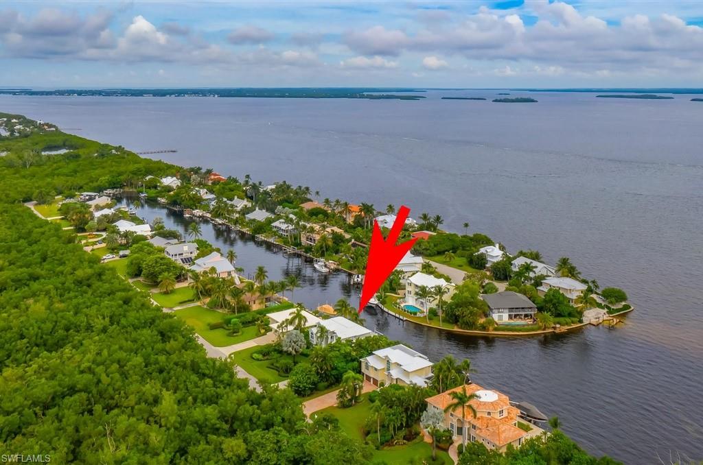 SANIBEL ISLAND "FLORIDA COASTAL" DESIGN W/SPECTACULAR $10,000,000 BAYFRONT VIEWS! THIS IS A BUILDER'S CUSTOM MASTERPIECE, HAS 4+BDRM, 5.5BTH, GAME ROOM, MEDIA/ENTERTAINMENT ROOM, 2+ CAR GARAGE, POOL-SPA, HAS IT ALL!. NO BRIDGES W/DEEP WATER YACHT ACCESS. OPEN FLOOR PLAN, MULTIPLE LIVING & ENTERTAINMENT LEVELS W/ELEVATOR ACCESS FOR ALL GENERATIONAL NEEDS. MAIN LIVING AREA HAVE WALL-TO-WALL GLASS SLIDERS + WINDOWS MAKING THE HOME LIGHT & BRIGHT YEAR ROUND. 10'/12' TRAYED CEILINGS W/CUSTOM  WOOD "MILLED" CROWN MOLDING & ACCENTS. A STUNNING "CHEFS" KITCHEN W/CUSTOM ANTIQUE FINISHED WOOD CABINETS, TOP-LINE STAINLESS STEEL APPLIANCES, LEVEL 5 GRANITE TOPS W/CENTER ISLAND & GAS COOK STATION. MULTIPLE TERRACES & DECKS OVERLOOKING SAN CARLOS BAY W/EASY CLOSE ELECTRIC ROLL-DOWN SHUTTERS FOR TOTAL STORM PROTECTION! HUGE MASTER BDR, MASTER BTH HAS HIS+HER VANITIES, CUSTOM JETTED SOAKING TUB,  WALK-IN TILED GLASS SHOWER & AN INCREDIBLE OVERSIZED WALK-IN CLOSET W/CUSTOM ORGINAIZERS. ALL GUEST BDRMS HAVE IN-SUITE PRIVATE BTHS & BALCONIES W/VIEWS! SUPER PAVER POOL DECK, HEATED POOL W/CUSTOM WATERFALL. 70' DOCK W/16,000LB LIFT. COMES W/1 YEAR HOME WARRANTY. EAST ISLAND W/EASY ON/OFF ISLAND!